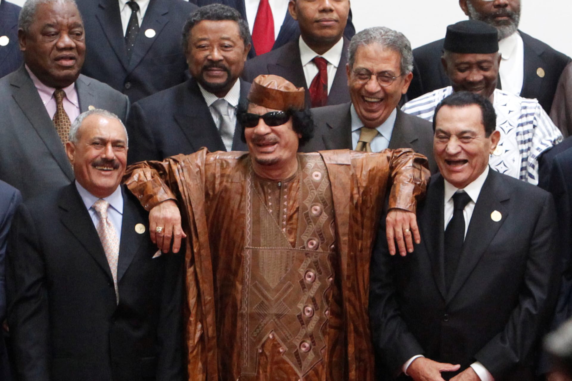 <p>Then Libyan leader Muammar al-Gaddafi (C), then Egyptian President Hosni Mubarak (centre R) and then Yemeni President Ali Abdullah Saleh (centre L) as they laugh during a photocall before the second Afro-Arab Summit in 2010.</p>
