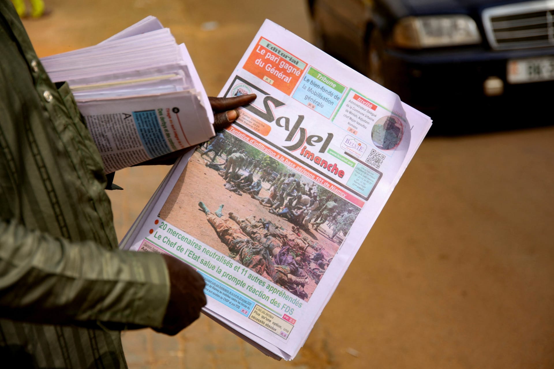 <p>A man sells newspapers in a street, following an attack on the international airport in Niamey, Niger, on January 30, 2026.</p>
