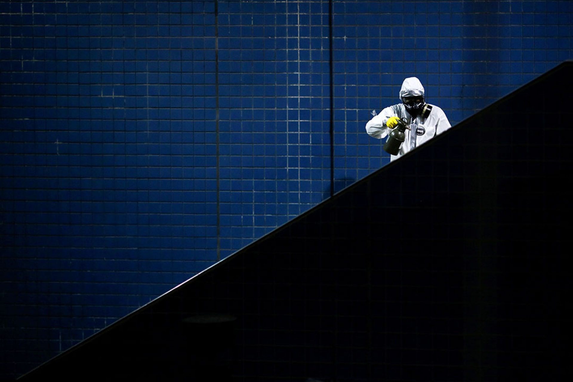 <p>A member of Brazil’s armed forces sprays disinfectant in the Metro’s Central station amid the COVID-19 pandemic, in Brasília, Brazil, March 2020.</p>
