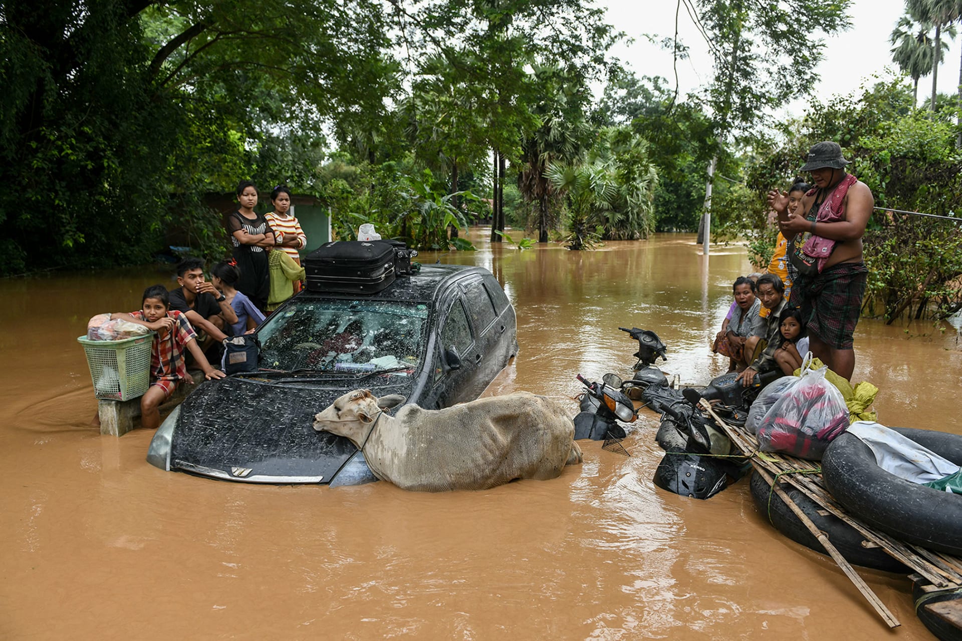 <p>BAGO REGION, MYANMAR: Residents wait for a rescue boat to arrive in the town of Taungoo in the aftermath of Typhoon Yagi in September 2024. <span class="immersive-image__figcaption-credit">Sai Aung Main/AFP/Getty Images</span></p>
