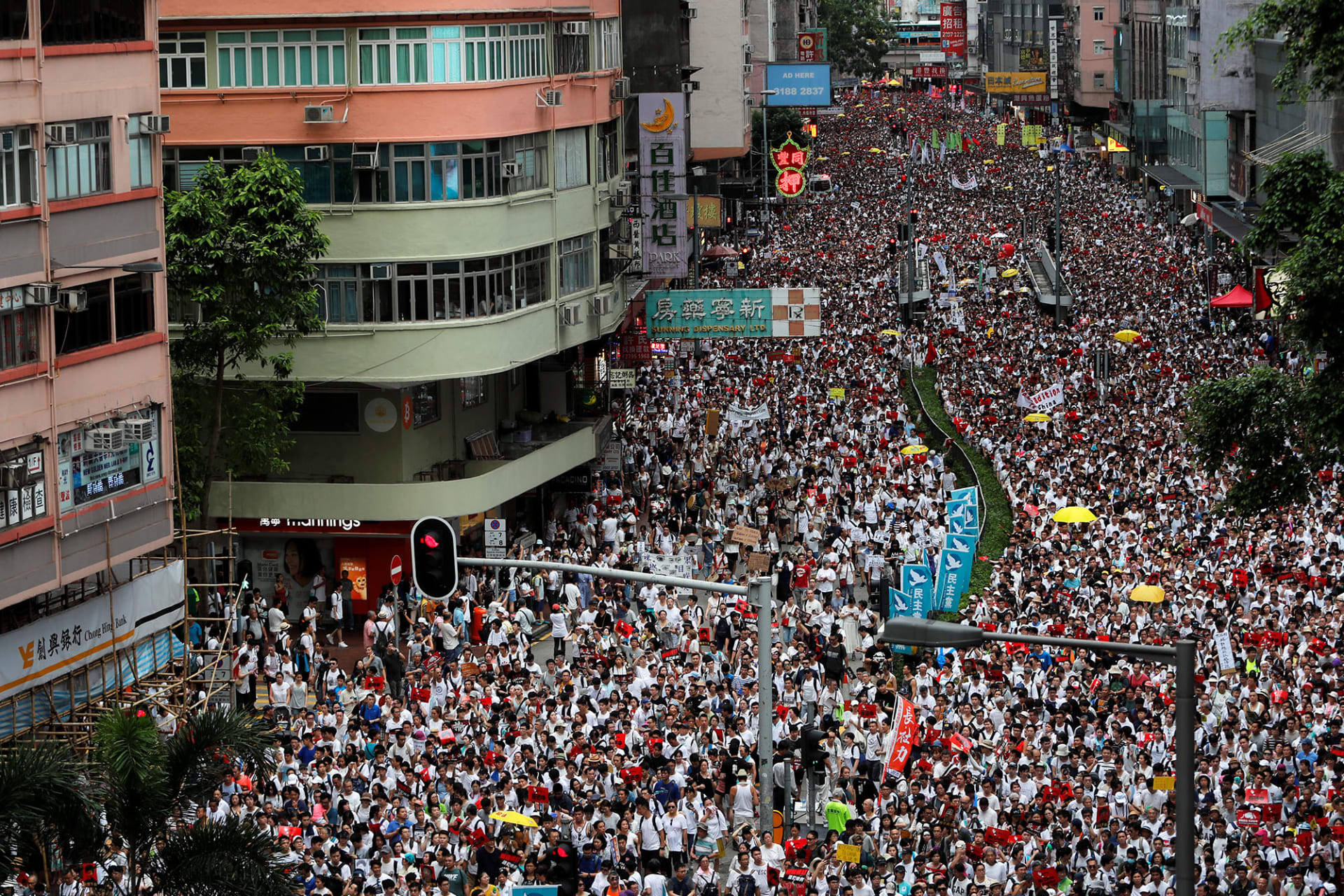 Image of mass demonstrations flooding streets in Hong Kong.