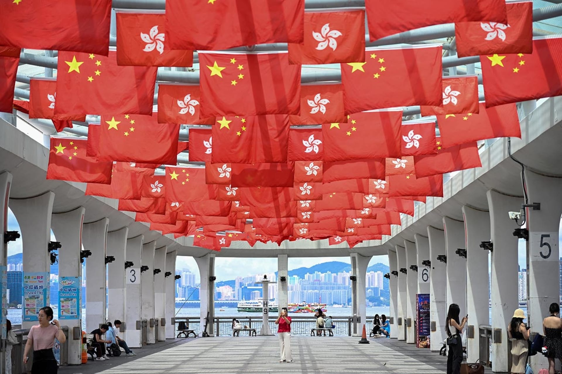 Image of Chinese and Hong Kong flags hanging up from the ceiling.