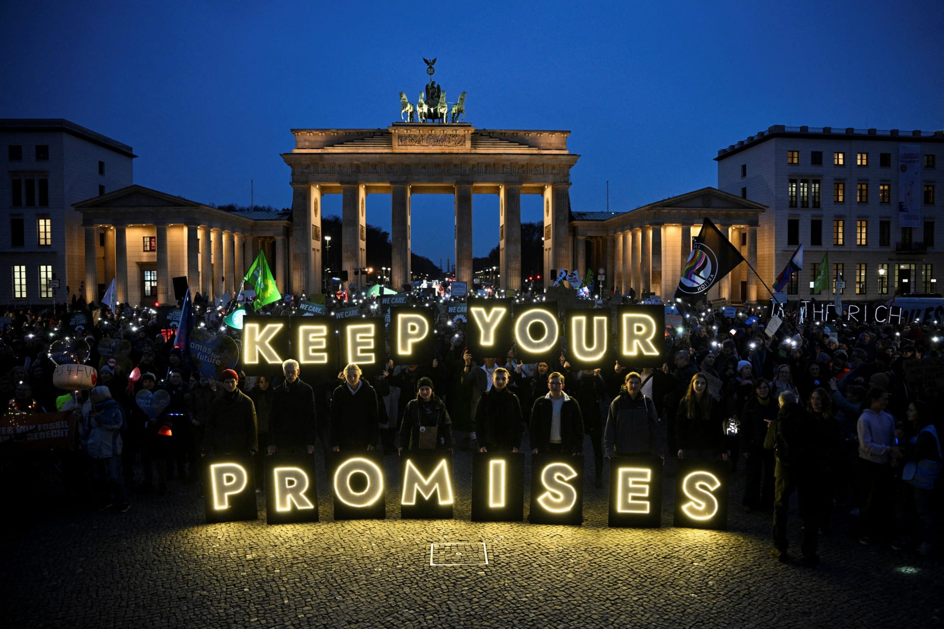 Demonstrators attend the Fridays for Future protest '#JustTransitionNow' next to the Brandenburg Gate during the United Nations Climate Change Conference (COP 30) which takes place in Belem, Brazil, in Berlin, Germany, November 14, 2025.