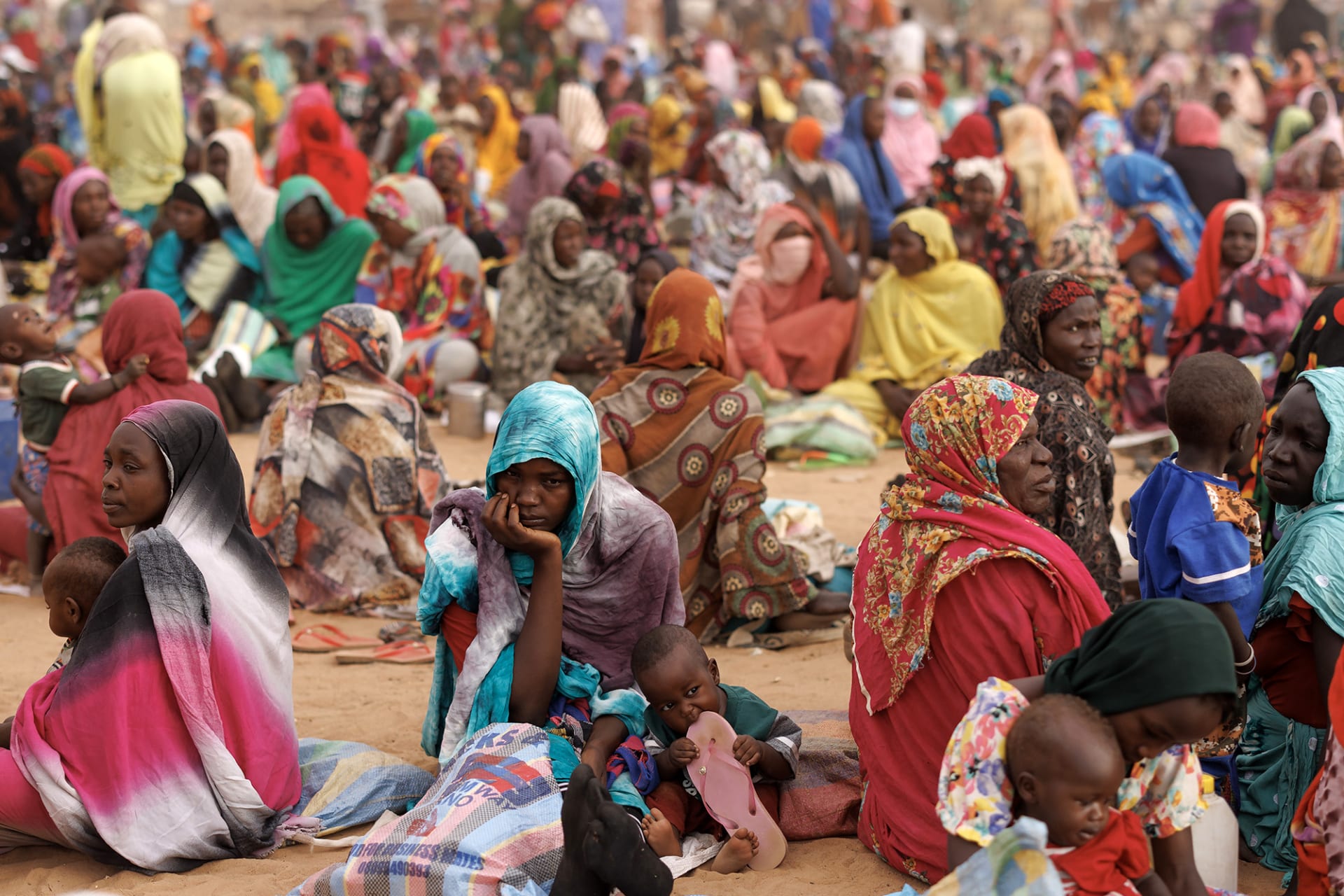 <p><span class="large-caption">ADRE, CHAD: Refugees, mostly women and children, wait for a WFP food distribution point to open at a temporary camp.</span> <span class="immersive-intro__figcaption-credit">Dan Kitwood/Getty Images</span></p>
