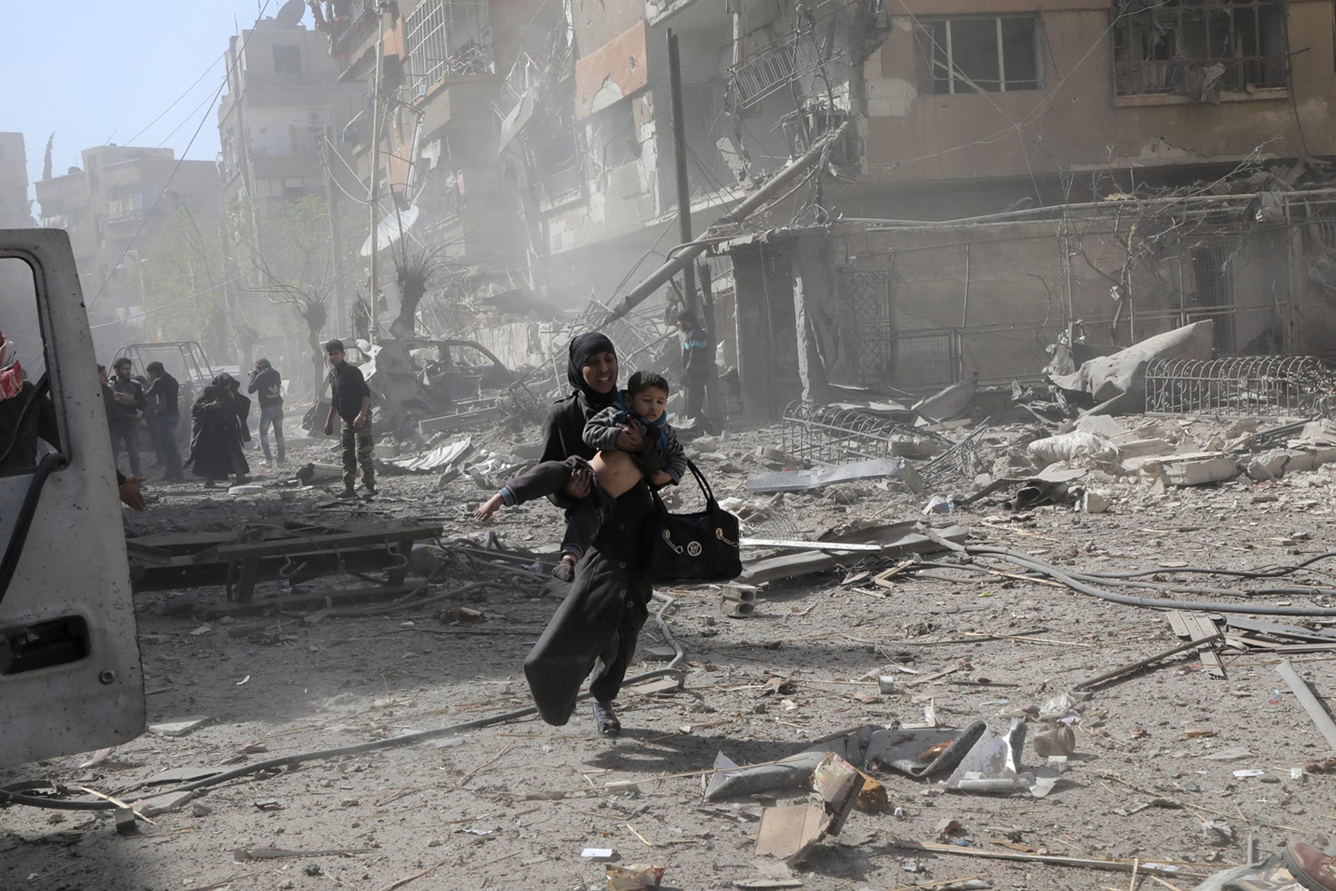 <p>DOUMA, SYRIA: In 2018, government air strikes on the rebel-held enclave of Douma, outside the Syrian capital of Damascus, had devastating effects on civilians. Hamza Al-Ajweh/AFP/Getty Images</p>
