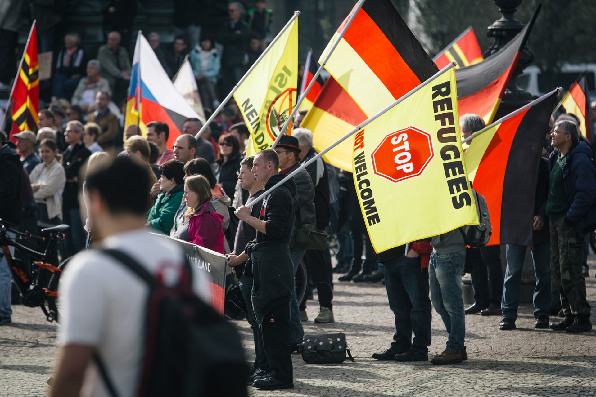 <p>DRESDEN, GERMANY: Supporters of the far-right, anti-immigrant movement known as Pegida attend a rally in eastern Germany in 2016. <span class="immersive-image__figcaption-credit">Oliver Killig/DPA/AFP/Getty Images</span></p>
