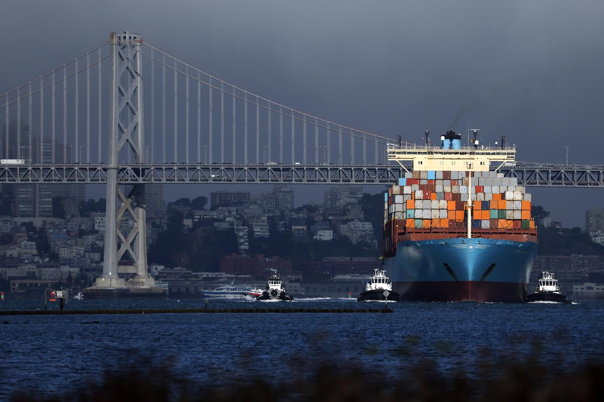 A container ship pulls into the Port of Oakland on August 01, 2025 in Oakland, California.