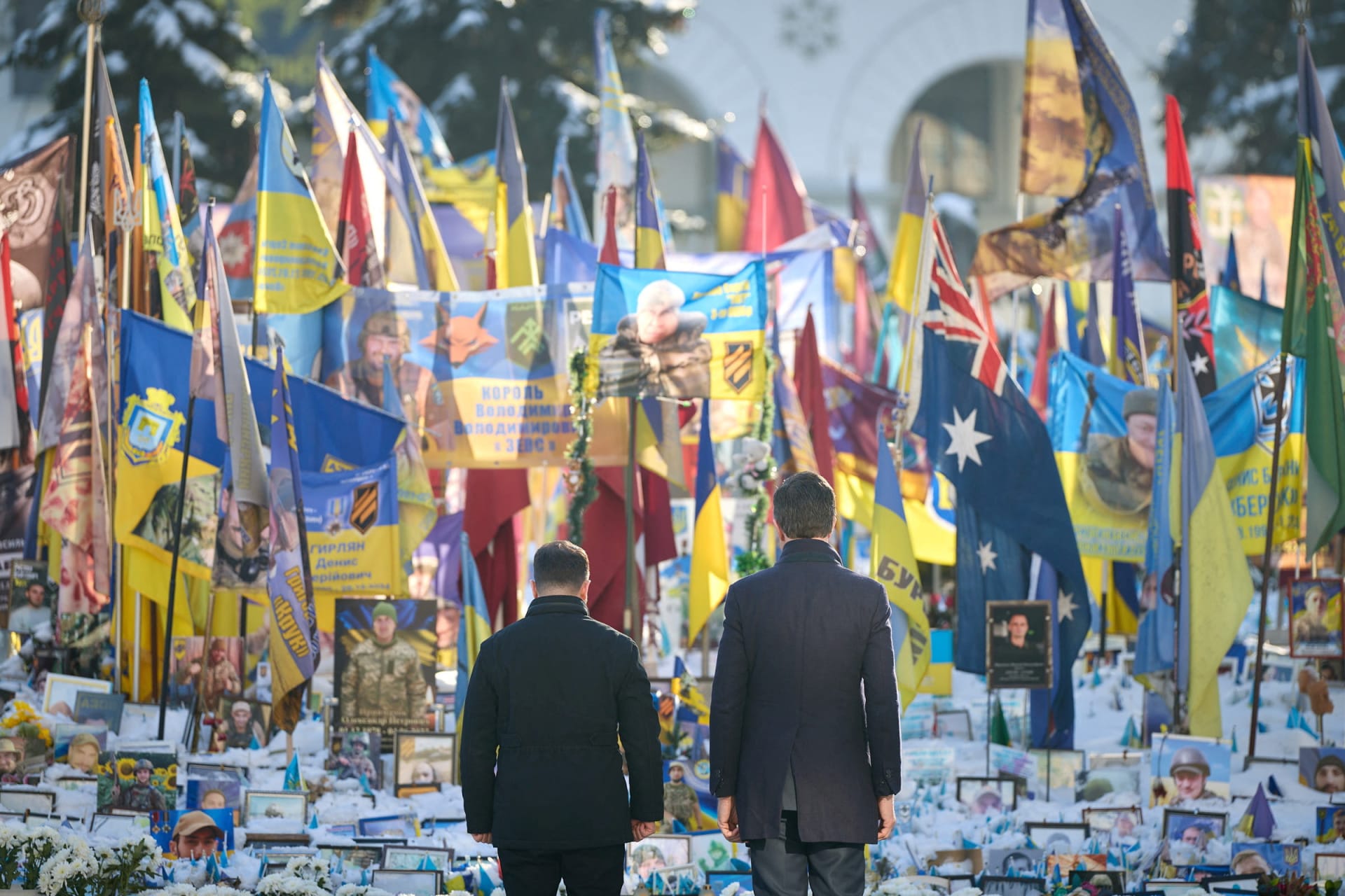Ukrainian President Volodymyr Zelenskyy and NATO Secretary General Mark Rutte visit a makeshift memorial for fallen Ukrainian defenders in Kyiv, Ukraine. Ukrainian Presidential Press Service/Reuters