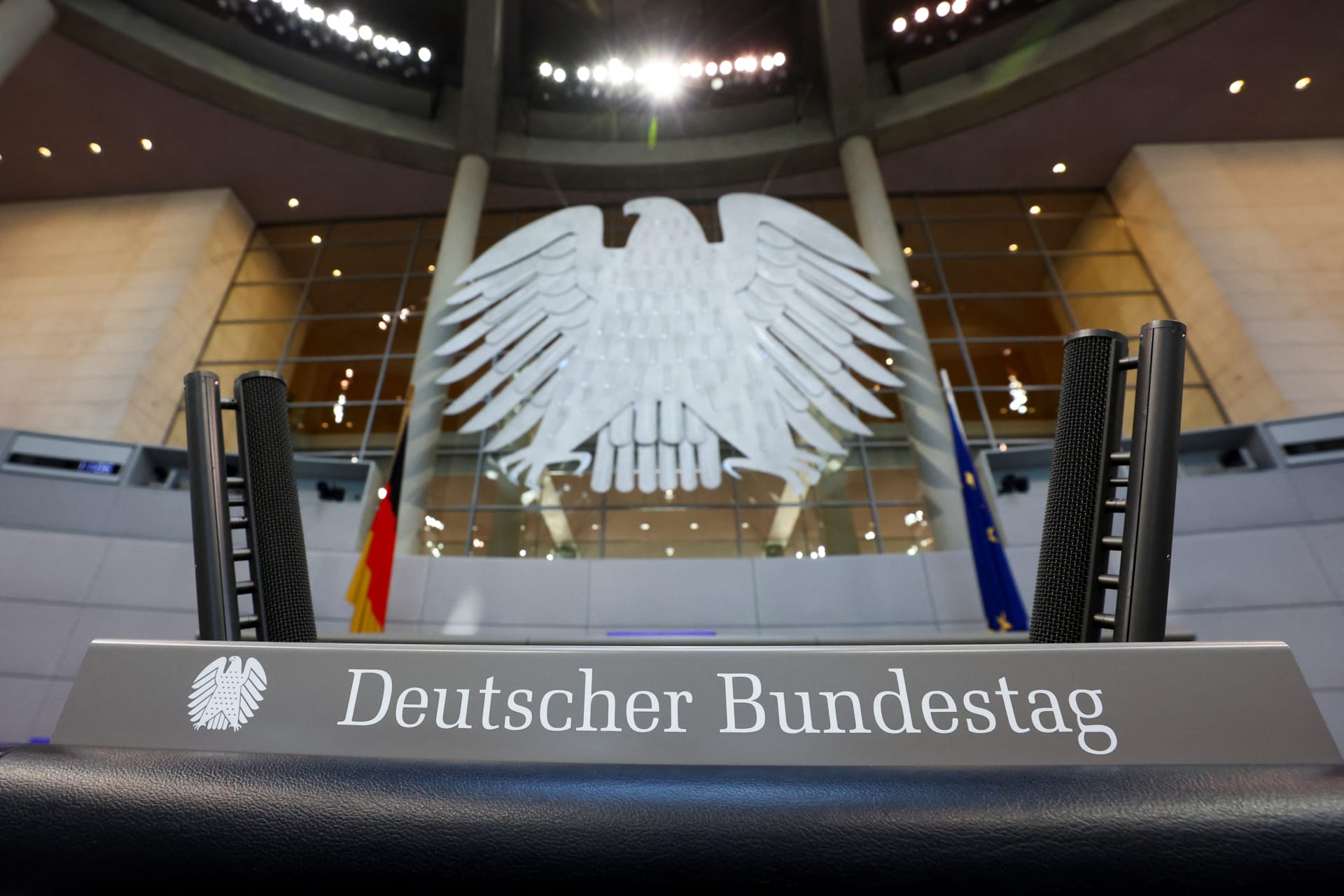 Workers prepare the plenary hall of the German lower house of Parliament, in Berlin