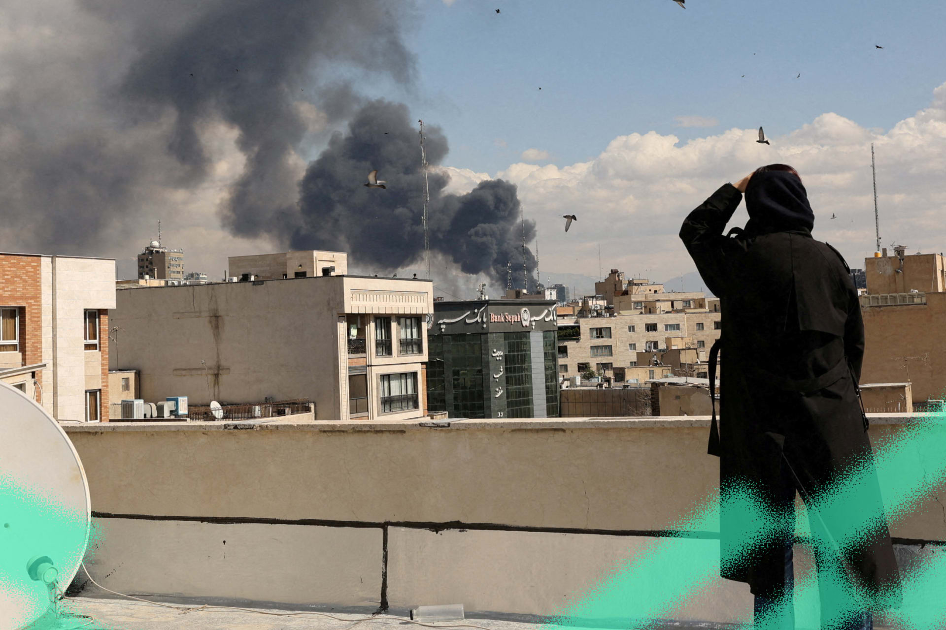 Smoke rises from Israeli and U.S. air strikes on Tehran, Iran, March 1, 2026.