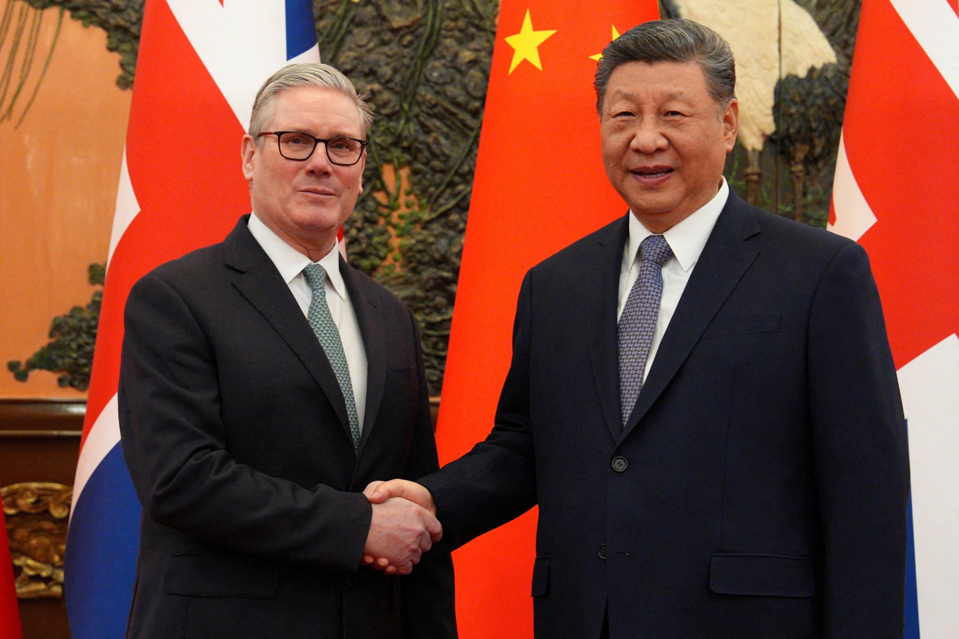 Britain's Prime Minister Keir Starmer shakes hands with Chinese President Xi Jinping, ahead of a bilateral meeting in Beijing, China, January 29, 2026. Carl Court/Pool via REUTERS REFILE