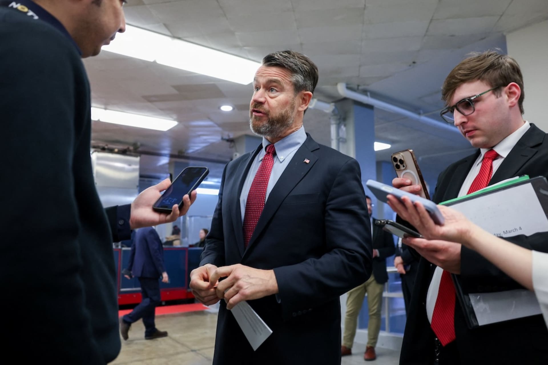 <p>U.S. Senator Todd Young (R-IN) speaks with reporters in the Senate subway during a vote in the U.S. Senate on a bipartisan war powers resolution aiming to stop the military campaign against Iran, on Capitol Hill in Washington, D.C., U.S., March 4, 2026. </p>
