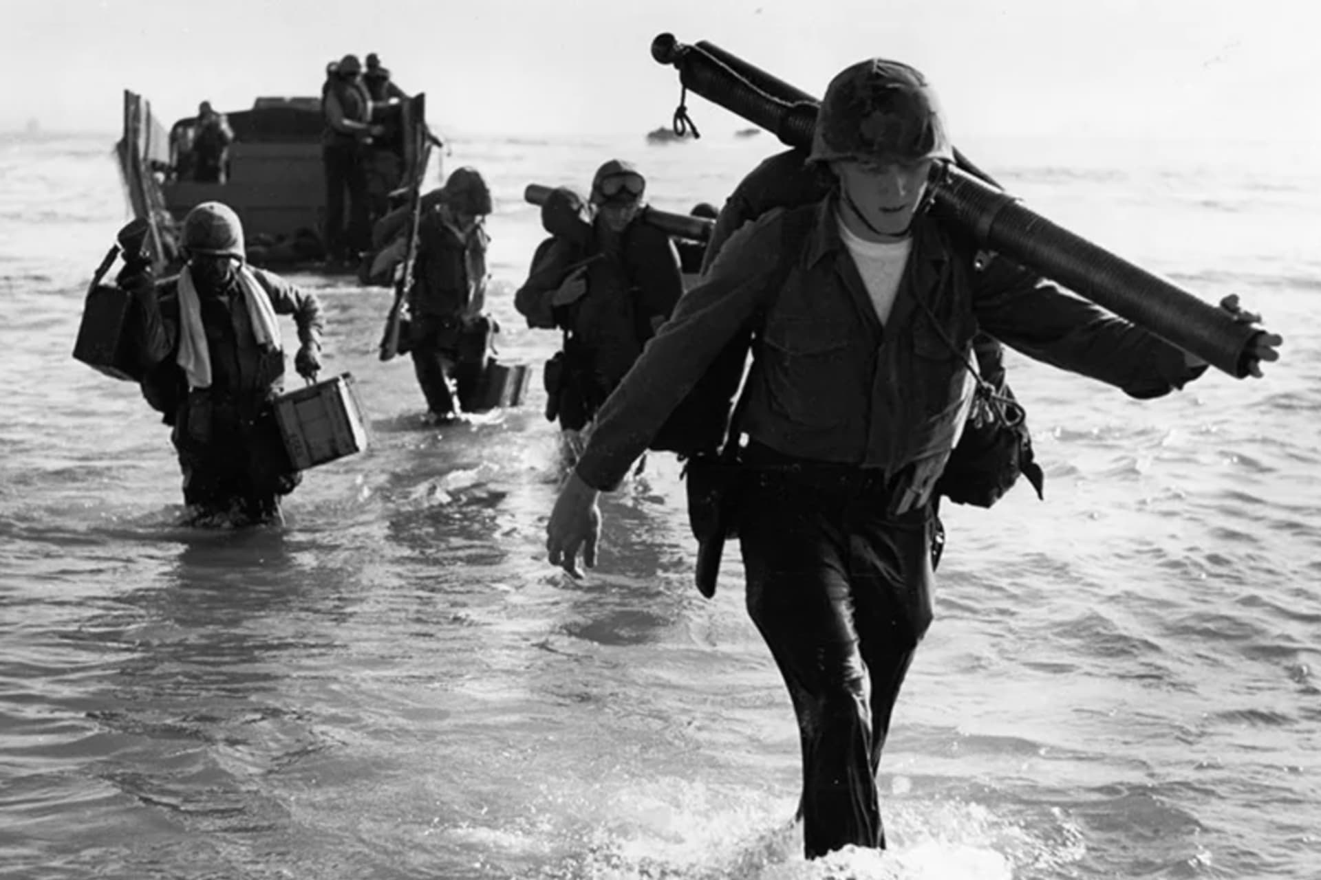 <p>United States Marines of the 9th Expeditionary Brigade wade ashore at Da Nang, Vietnam, March 8, 1965.</p>
