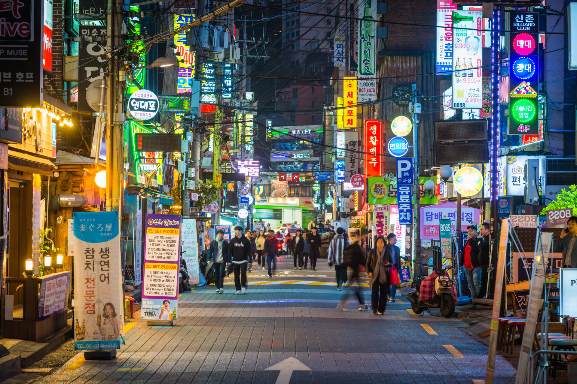 South Korea restaurants glowing neon night busy city streets Sinchon Seoul