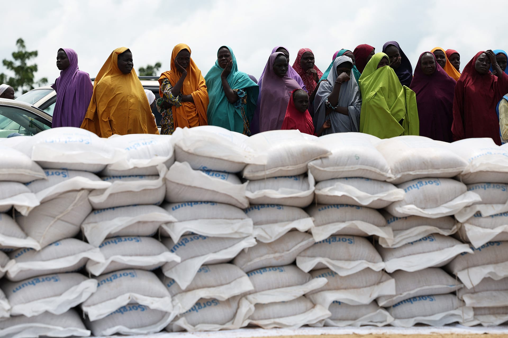 <p>Beneficiaries from different displacement camps wait to receive support at a World Food Program distribution center in Dikwa, Borno State, Nigeria, August 27, 2025.</p>
