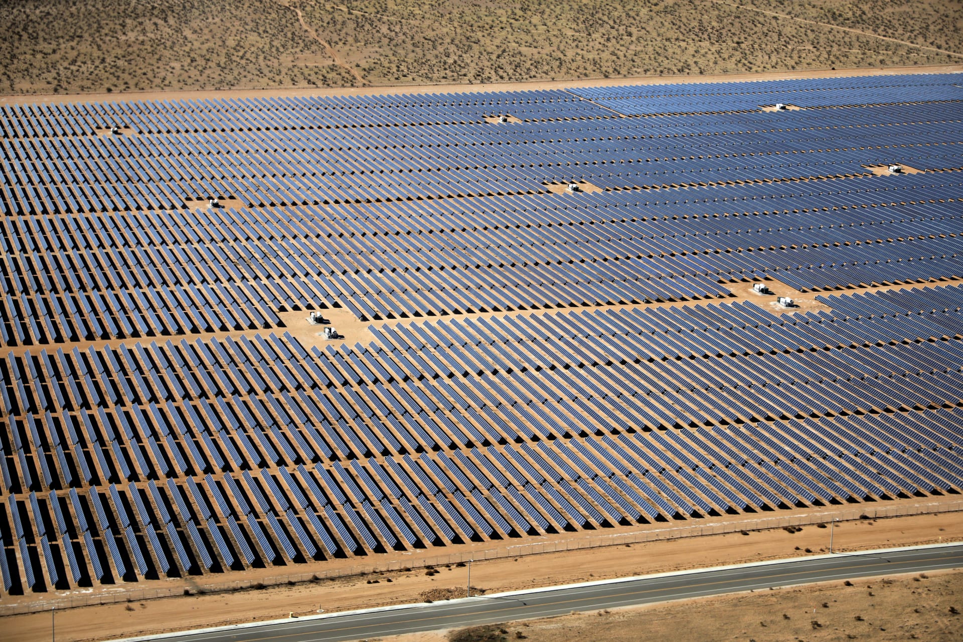 An array of solar panels is seen in the desert near Victorville