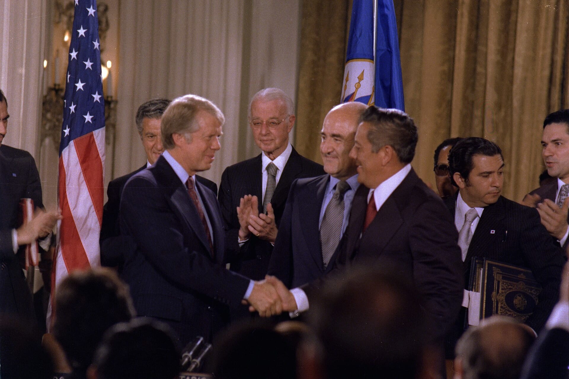 <p>President Jimmy Carter and Panamanian General Omar Torrijos shake hands after signing the Panama Canal Treaties, September 7, 1977.</p>
