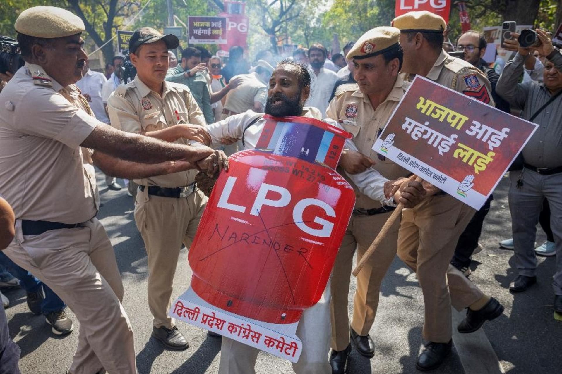 Police detain a supporter India’s main opposition Congress party on March 13, 2026, during a protest in New Delhi against price hikes and supply disruptions of liquified petroleum gas (LPG) cylinders following the U.S.-Israeli conflict.