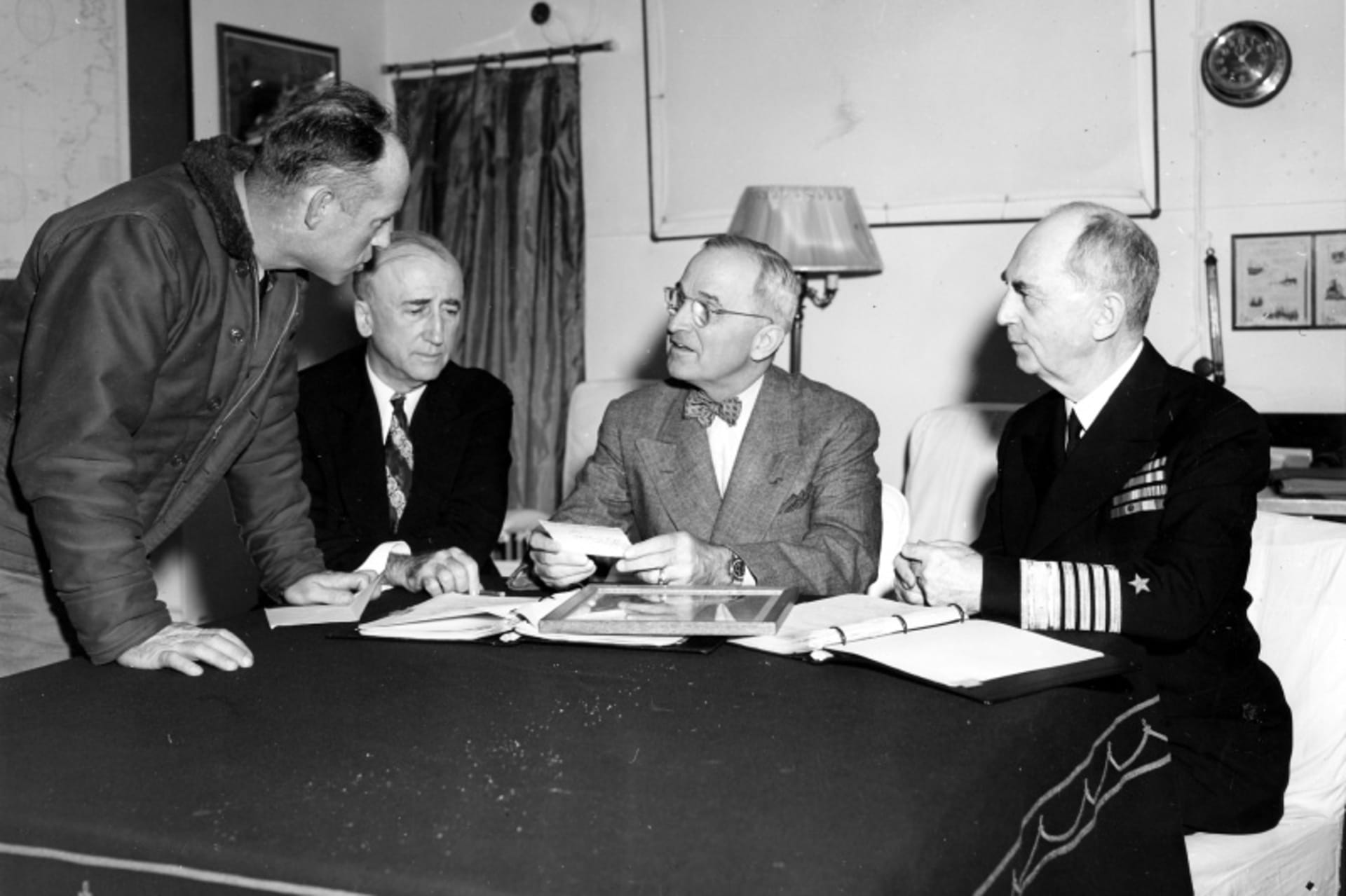 <p>President Harry S. Truman confers with Secretary of State James Byrnes and Admiral William Leahy in preparation for the Potsdam Conference onboard the <i>USS Augusta</i>, July 12, 1945.</p>
