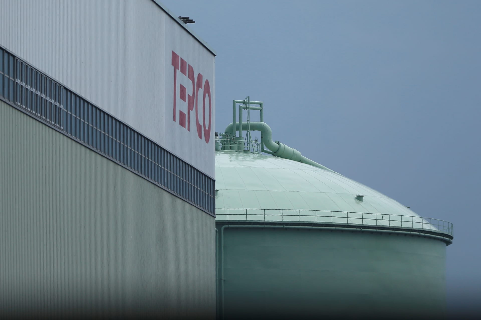The TEPCO logo and a LNG tank are seen at Tokyo TEPCO's South Yokohama Thermal Power Station in Yokohama
