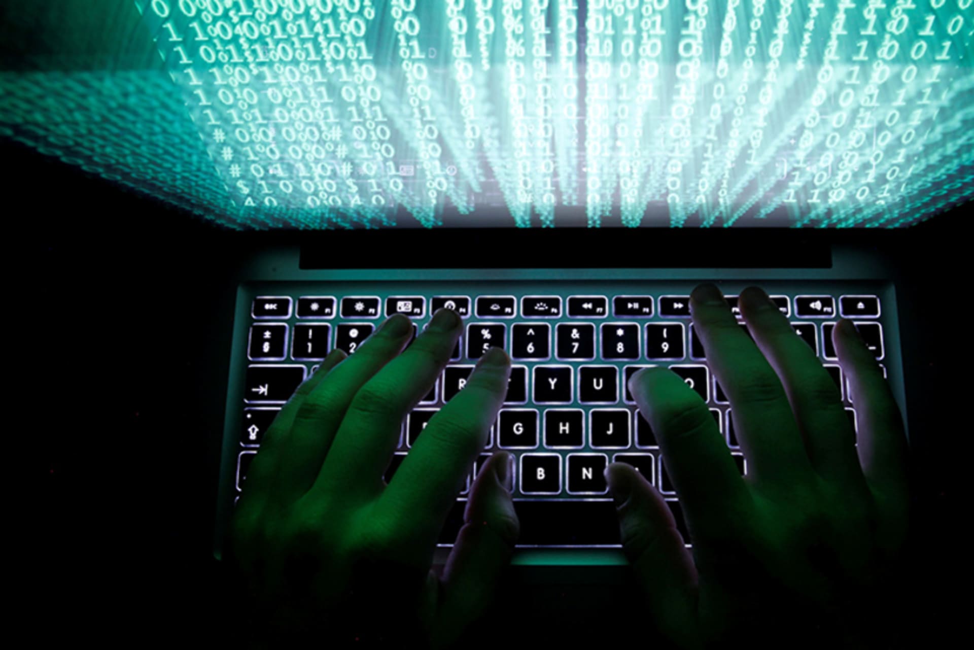 Man typing on computer