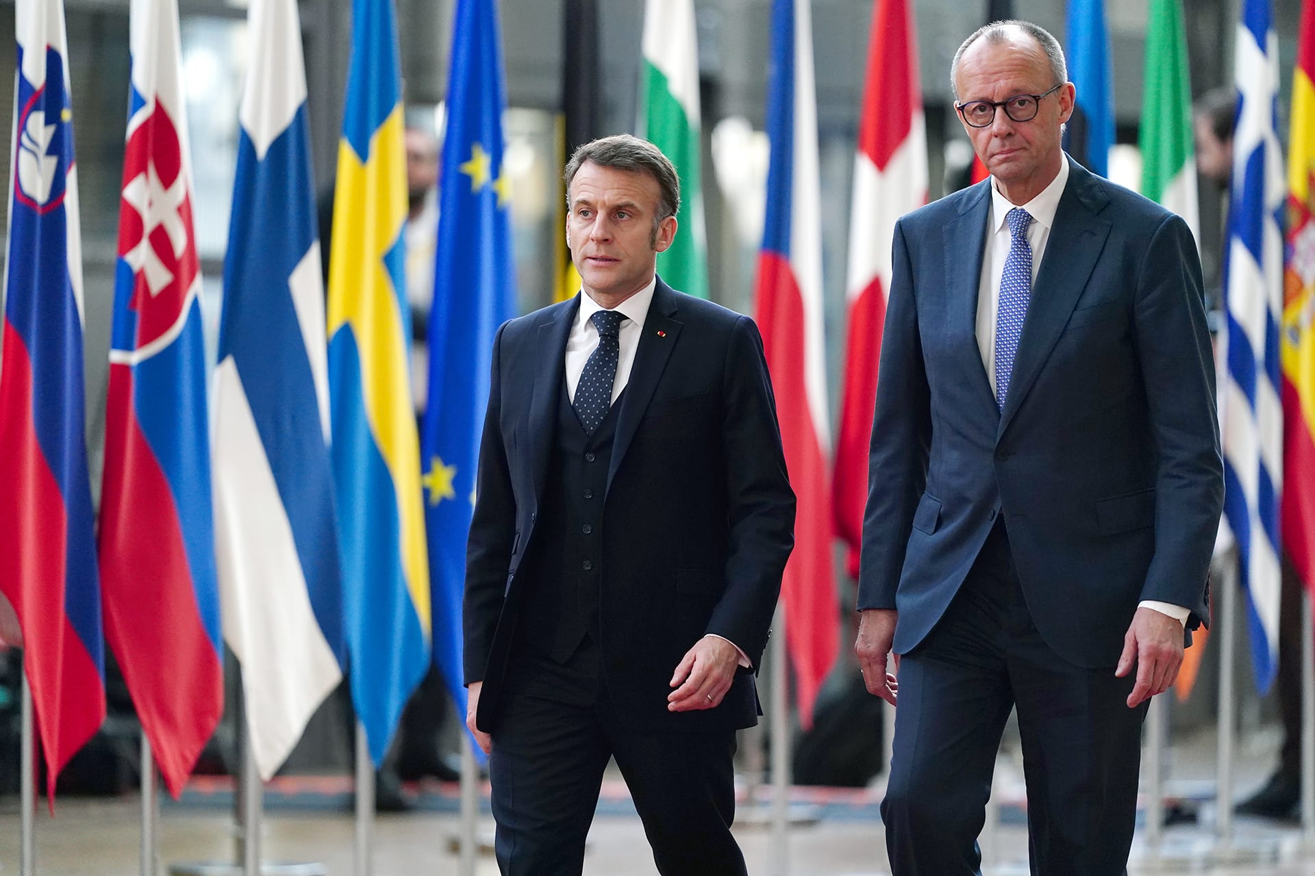 <p>French President Emmanuel Macron and German Chancellor Friedrich Merz arrive to the European Council summit on March 19, 2026 in Brussels, Belgium. European leaders discussed the military escalation in the Middle East and its consequences for energy prices and security, among other topics. </p>

