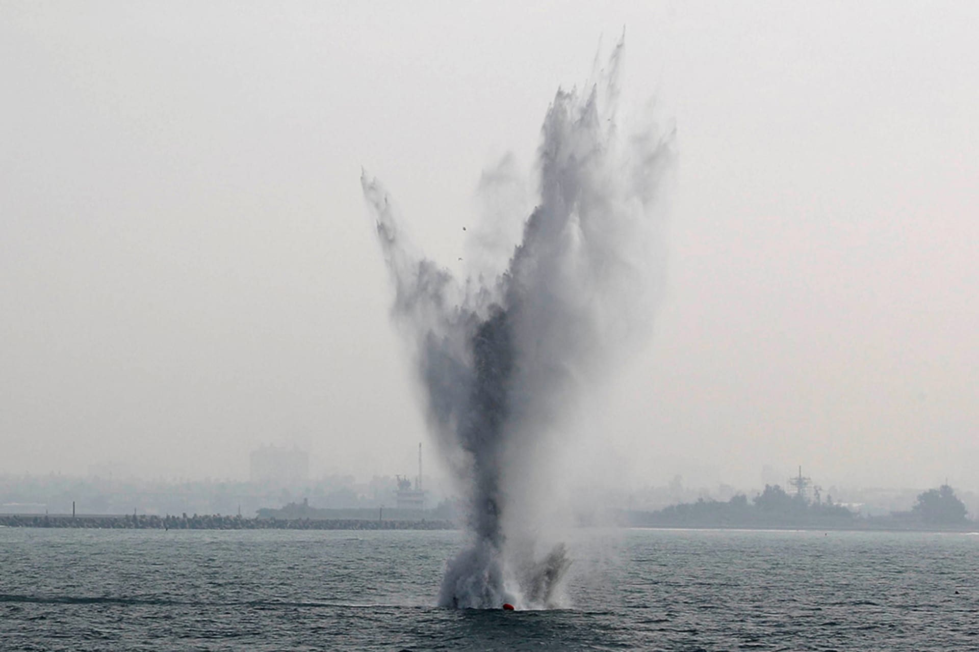 Naval mine blasts in sea.