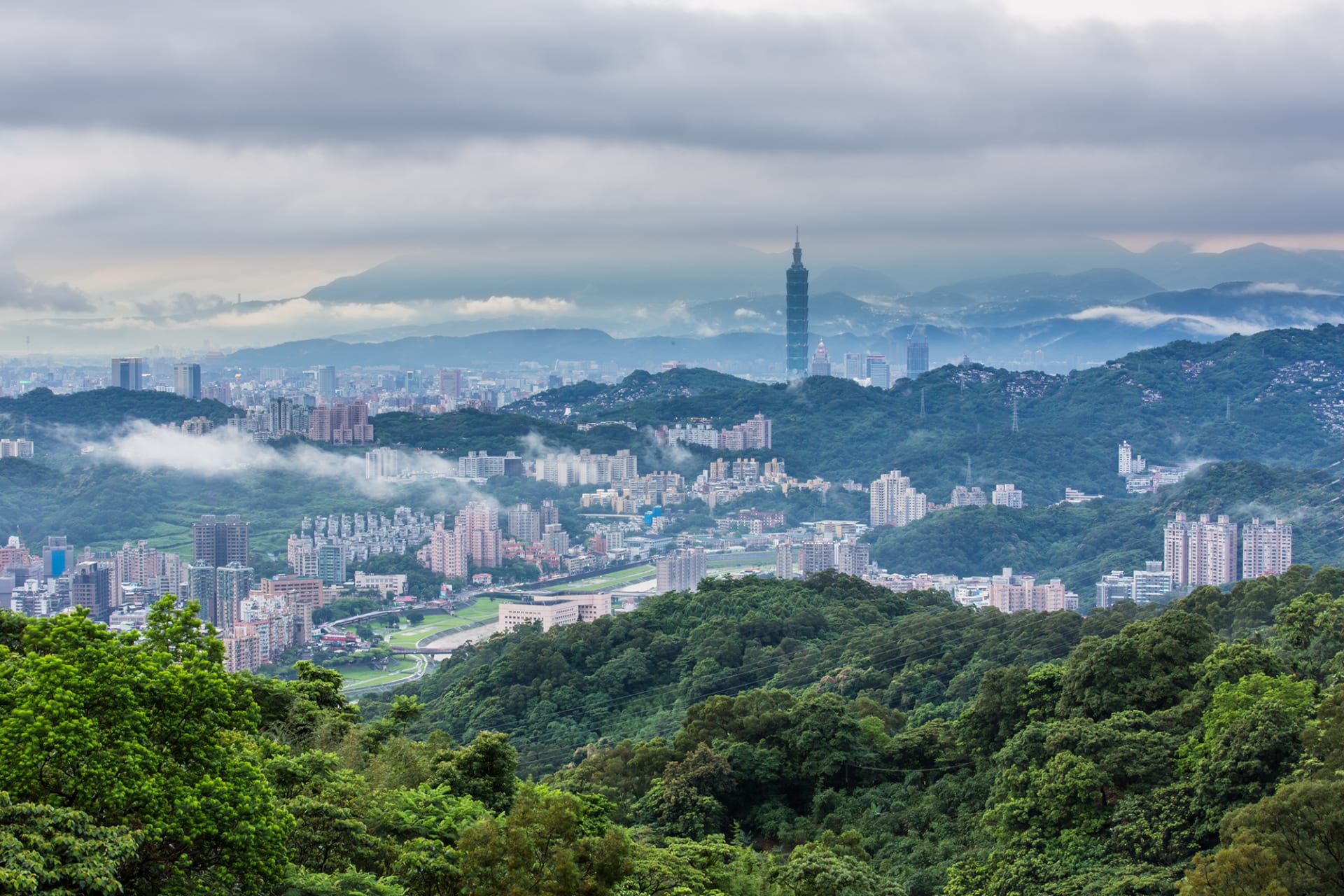 Taipei 101 surrounded by mountains, which ring Taiwan’s capital.