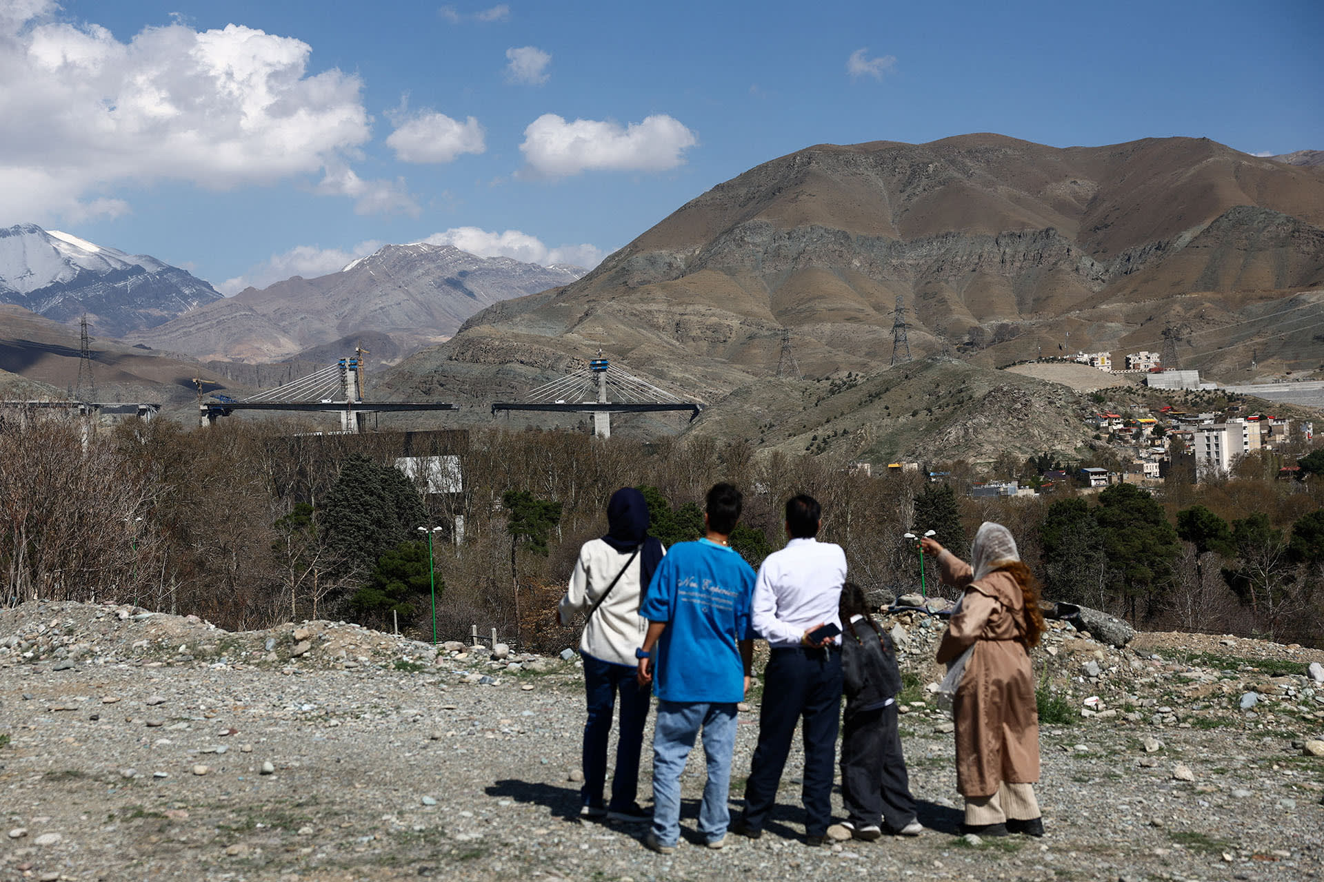 <p>Gathered onlookers observe the B1 bridge damaged by a strike, as the U.S.-Israeli conflict with Iran continues, in Karaj, Iran, April 3, 2026. </p>

