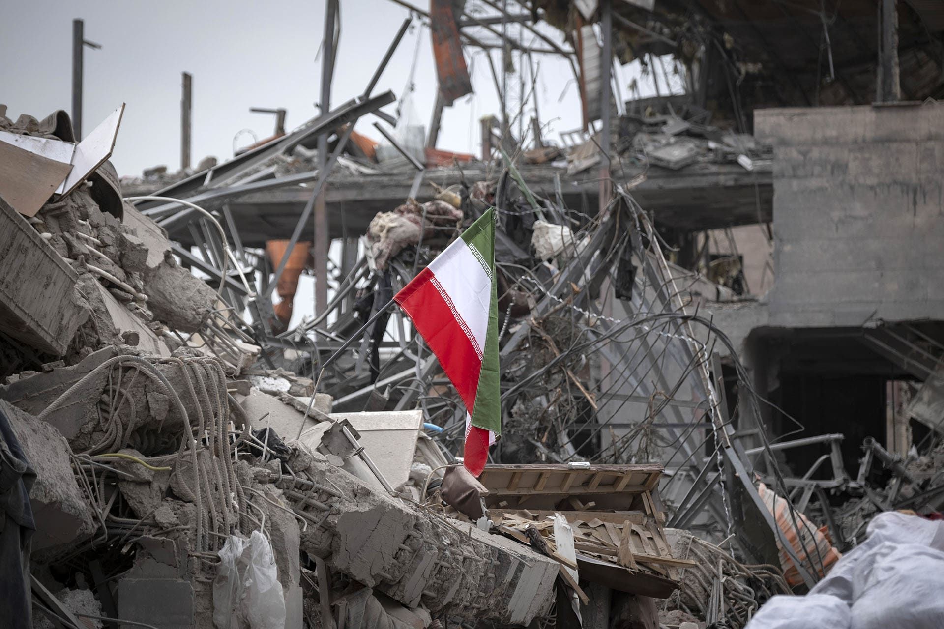 <p>A national flag is placed on the ruins of a building that is destroyed during the U.S.-Israeli military campaign that strikes a residential area on March 9, 2026, in Tehran, Iran, on March 12, 2026. </p>