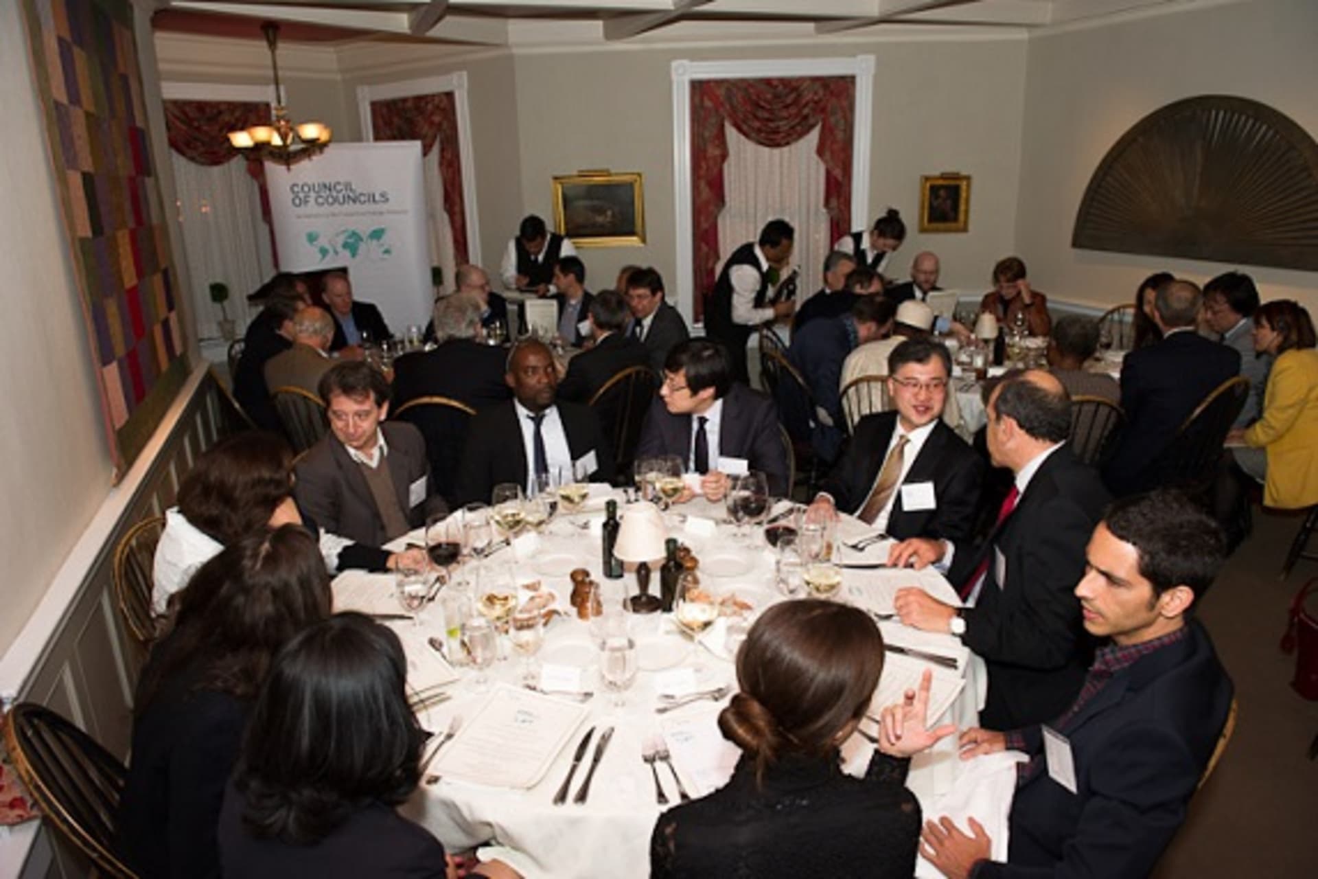 <p>Participants from twenty-two countries converse during the CoC Second Annual Conference opening dinner (Kaveh Sardari).</p>
