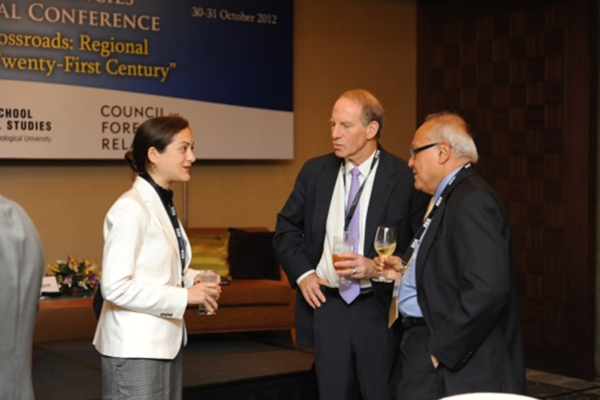 <p>Elena Lazarou (Getulio Vargas Foundation) converses with Barry Desker (RSIS) and Richard Haass (CFR) during the CoC First Regional Conference (William Lam).</p>
