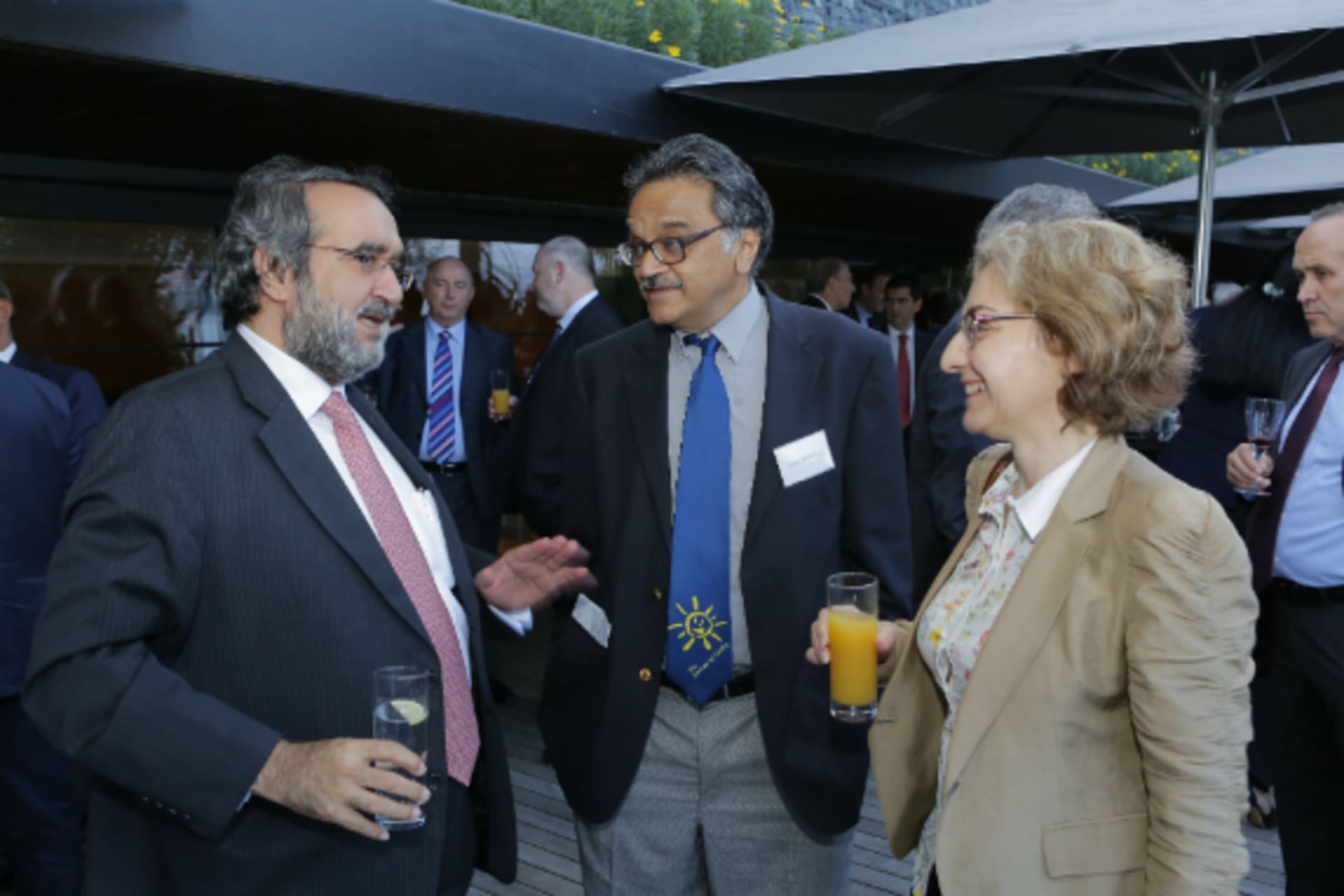 <p>Abdulaziz Sager, Sanjeev Ahluwalia, and Elizabeth Sidiropoulos at a cocktail reception at the Council of Councils Eighth Regional Conference. (Ferit Gelgec)</p>
