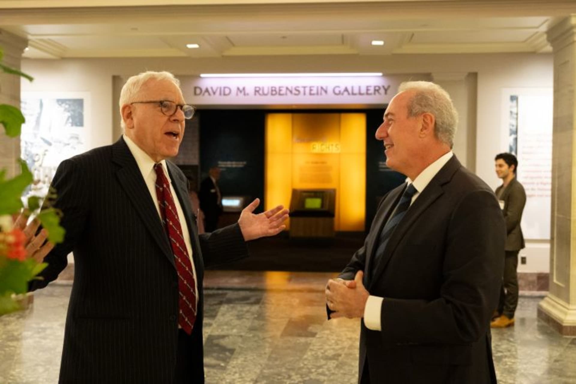 <p>David Rubenstein and Michael Froman outside the David Rubenstein Galleries at the National Archives Museum. Andrea Renda, Francisco de Santibanes, and Tracey Forrest discuss “Geopolitics, Diplomacy, and AI.” (Kaveh Sardari)</p>
