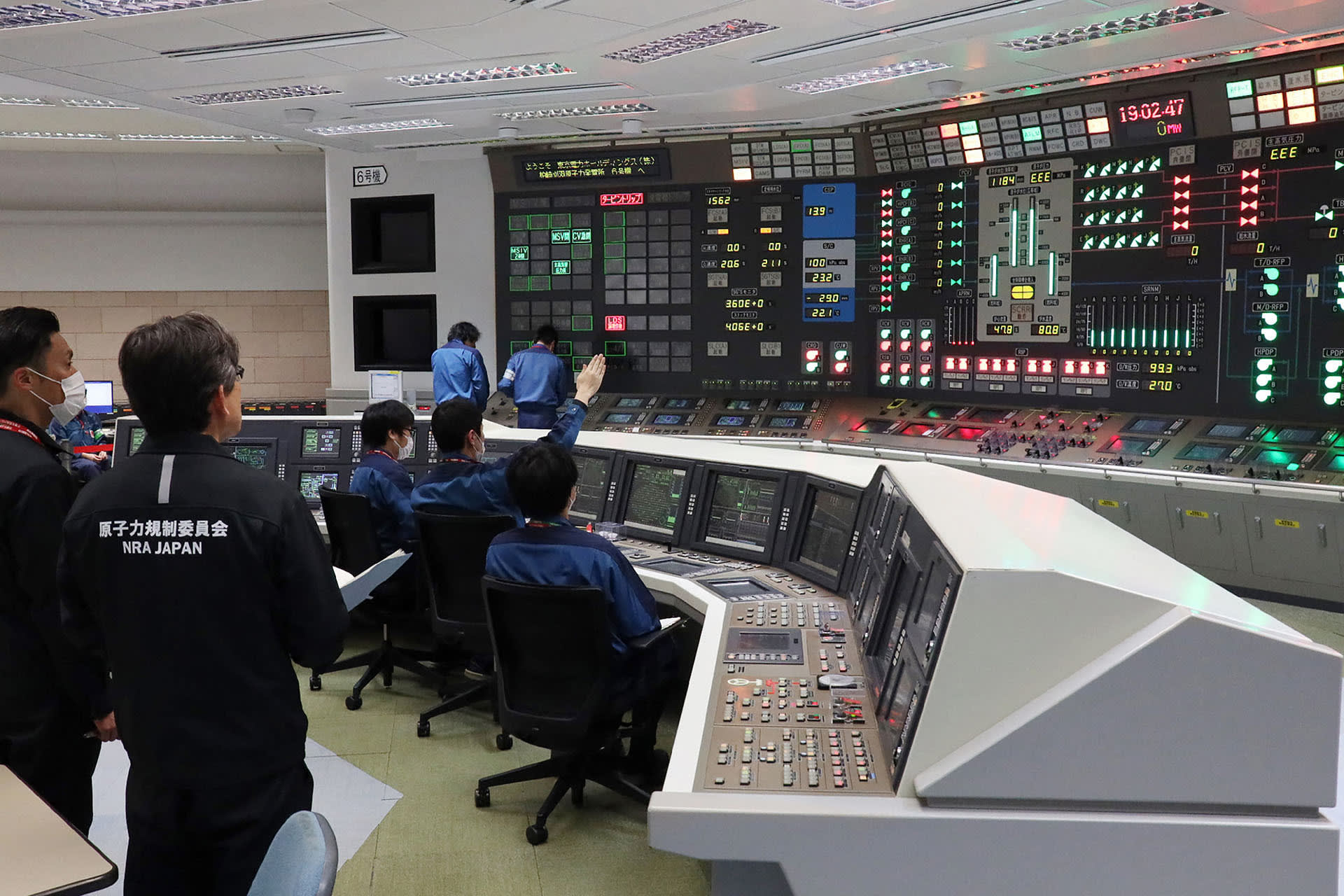 Image of nuclear power plant workers in Japan.