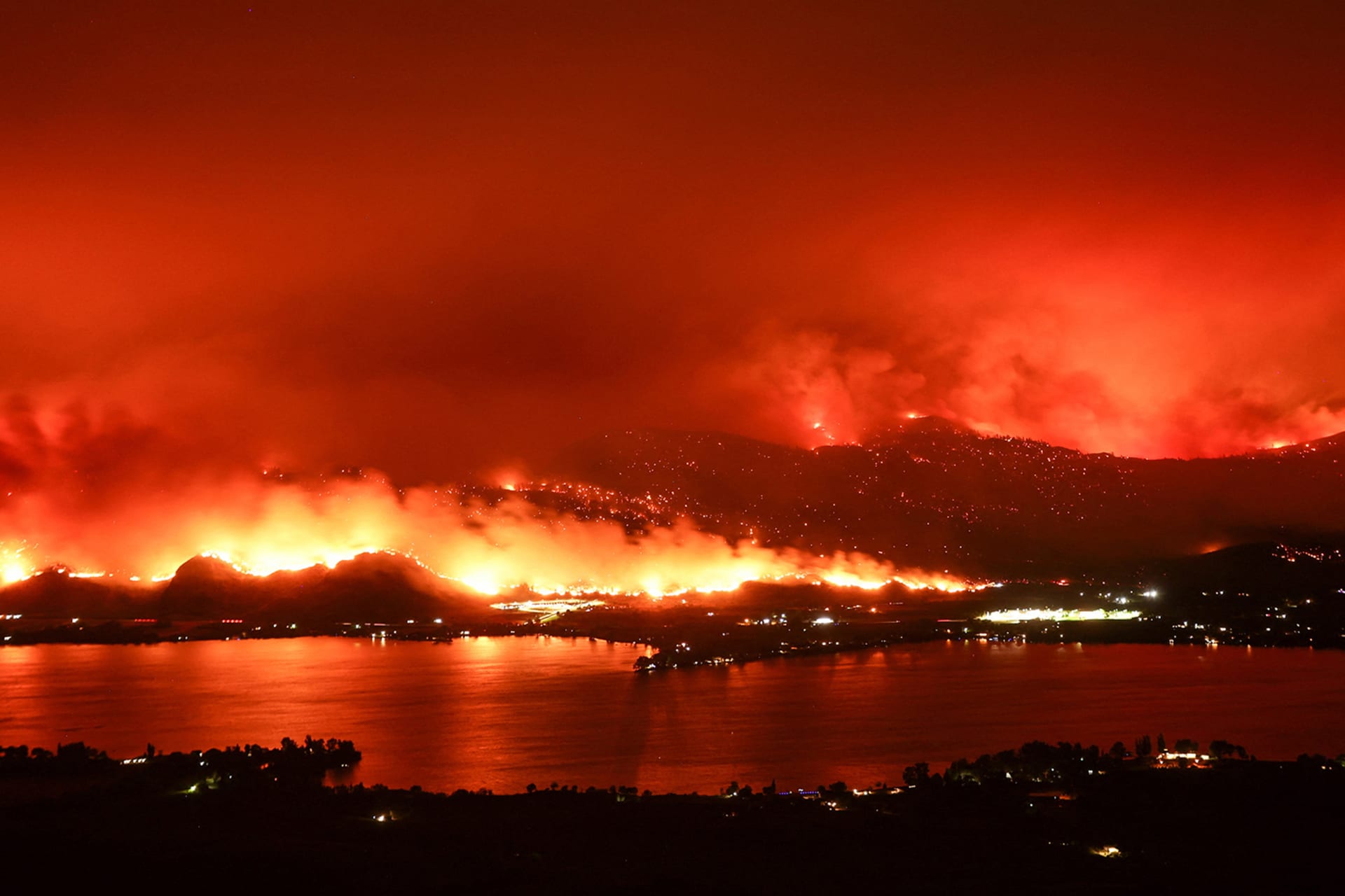 The Eagle Bluffs Wildfire burns across the Canada-U.S. border from the State of Washington into Osoyoos, British Columbia.