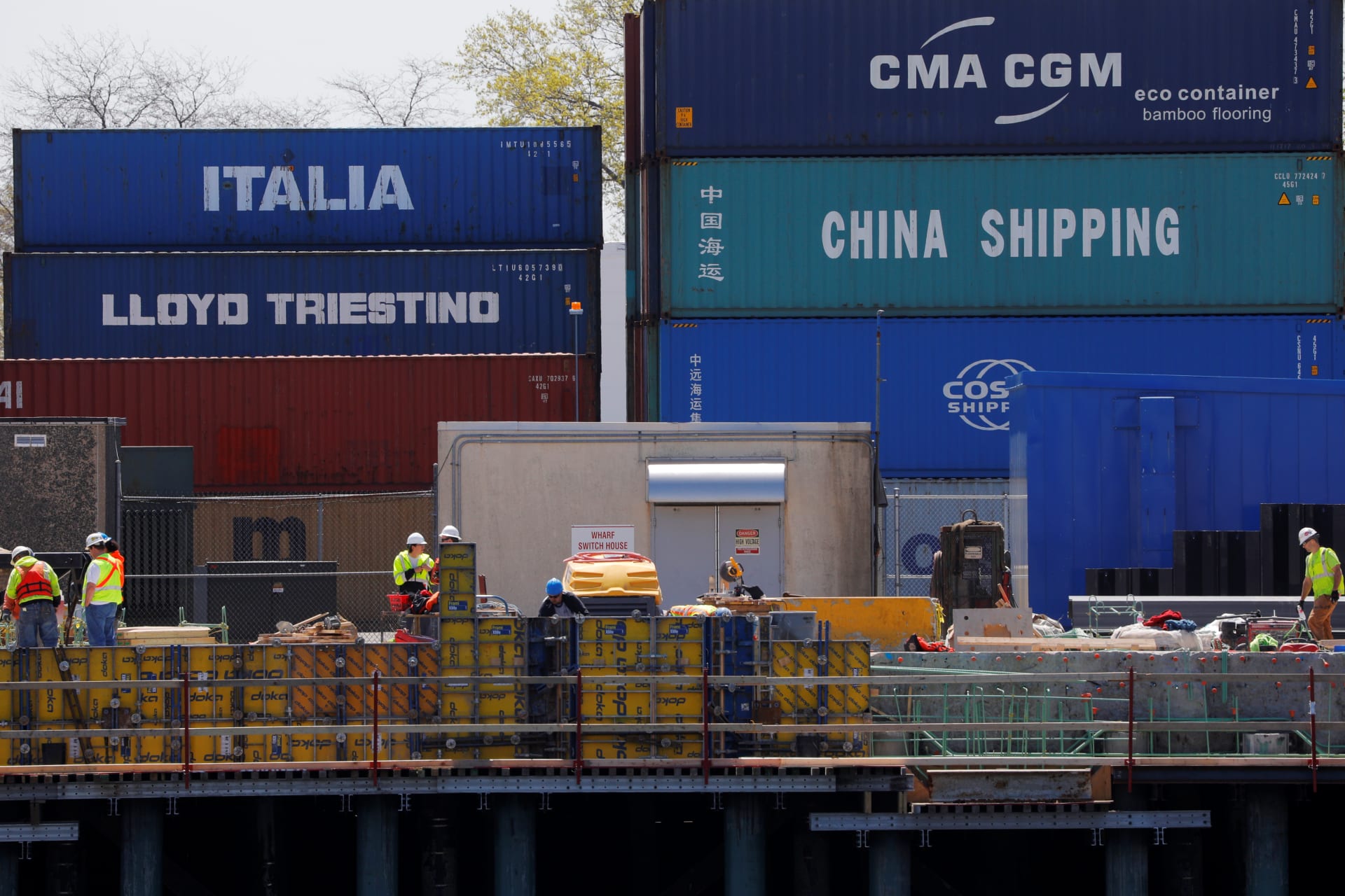 Shipping containers, including one labelled "China Shipping" and another "Italia," are stacked at the Paul W. Conley Container Terminal in Boston, Massachusetts, U.S., May 9, 2018. REUTERS/Brian Snyder