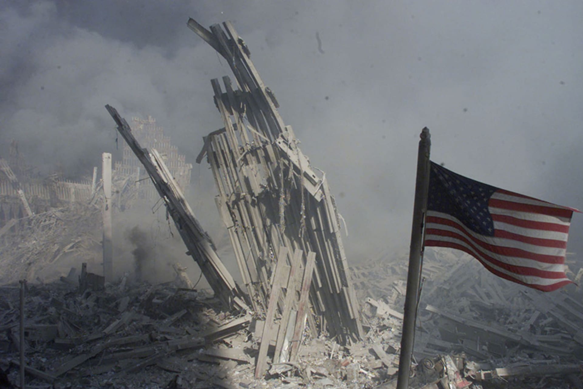 American flag flies amid the rubble and debris from the collapsed World Trade Center towers