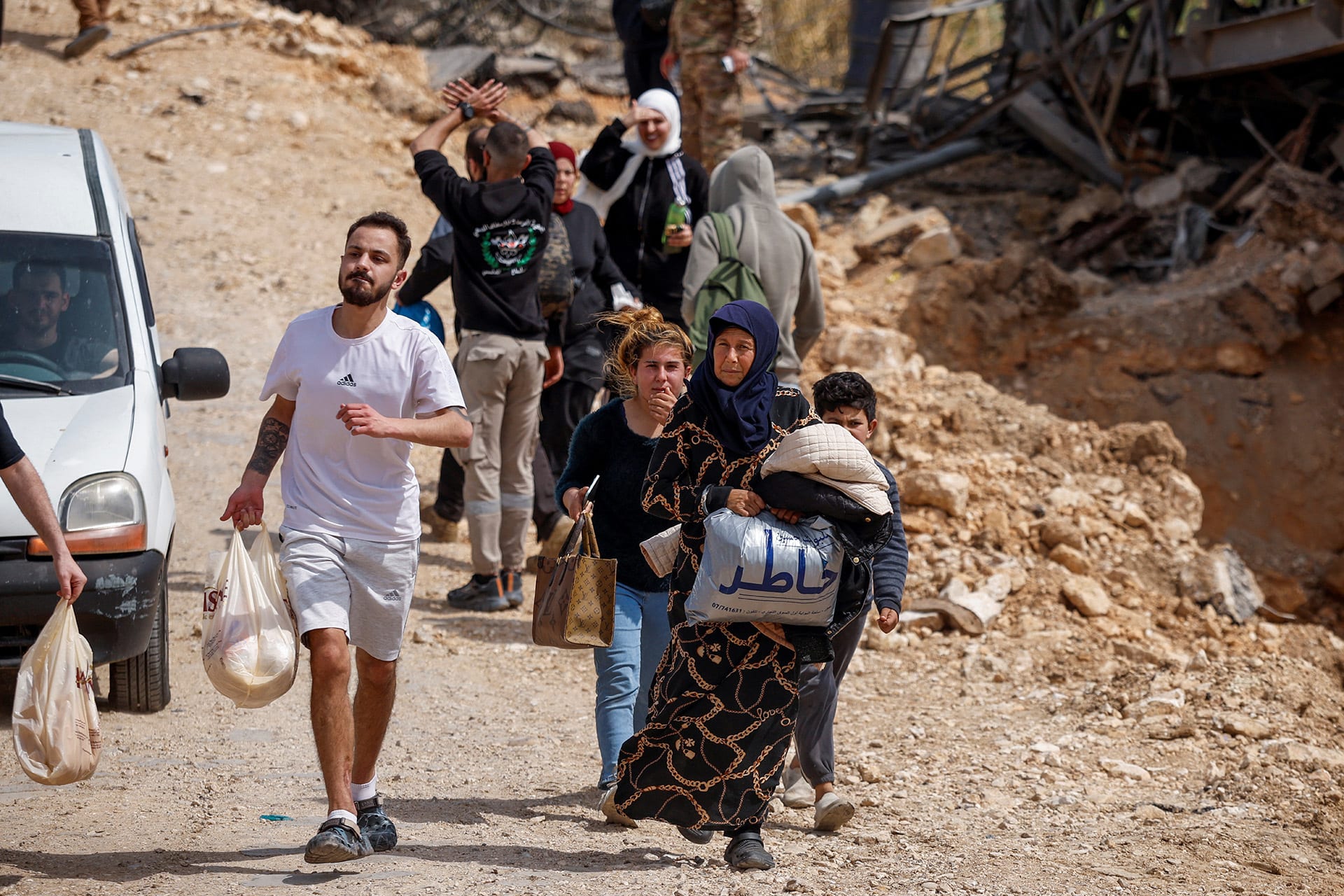 <p>Displaced people make their way back to their home crossing the bridge linking southern Lebanon to the rest of the country, which was hit earlier in an Israeli strike, after a ten-day ceasefire between Lebanon and Israel went into effect, in Qasmiyeh, Lebanon, April 17, 2026. </p>
