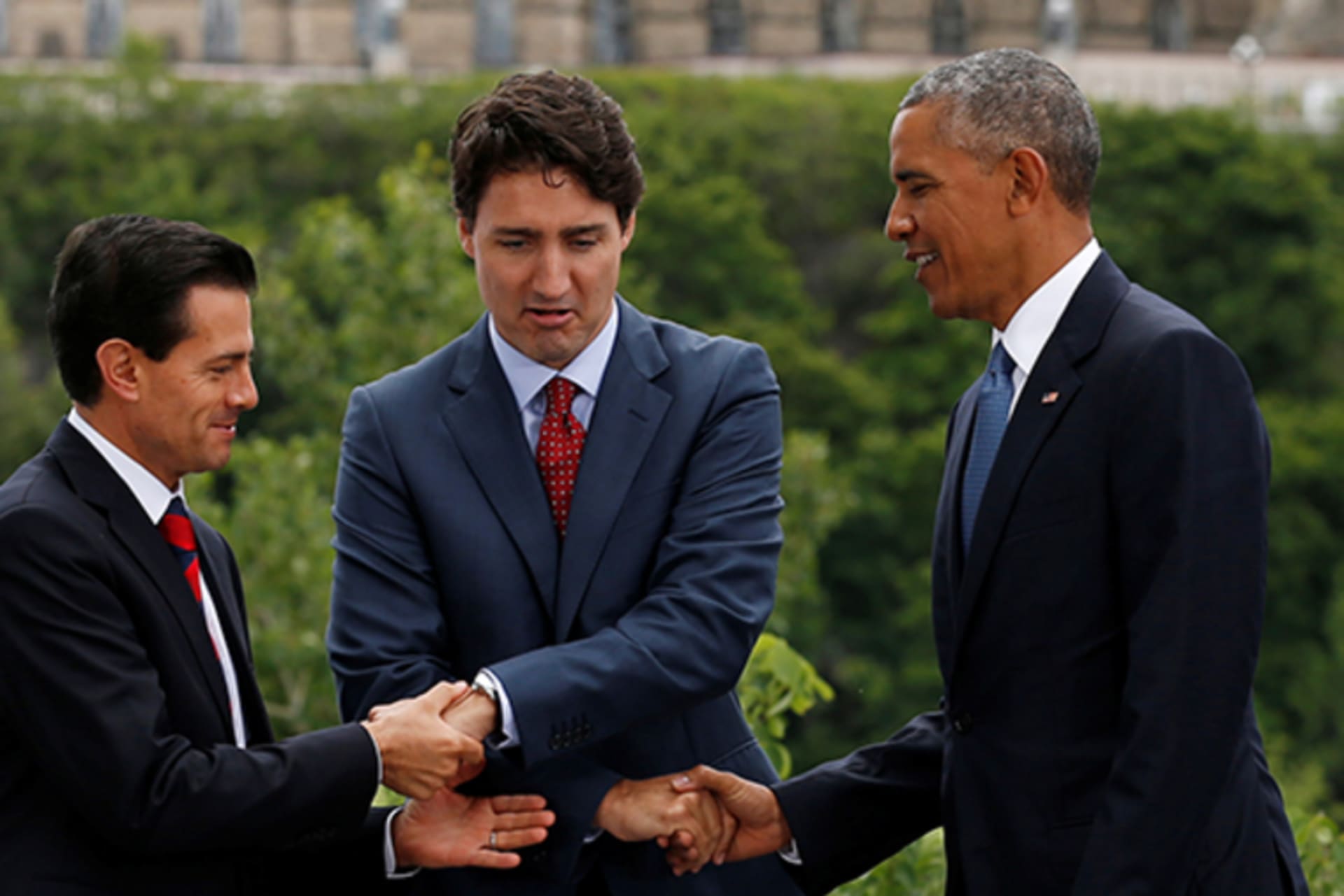 Mexico's President Pena Nieto, Canada's PM Trudeau and U.S. President Obama shake hands at the North American Leaders' Summit in Ottawa