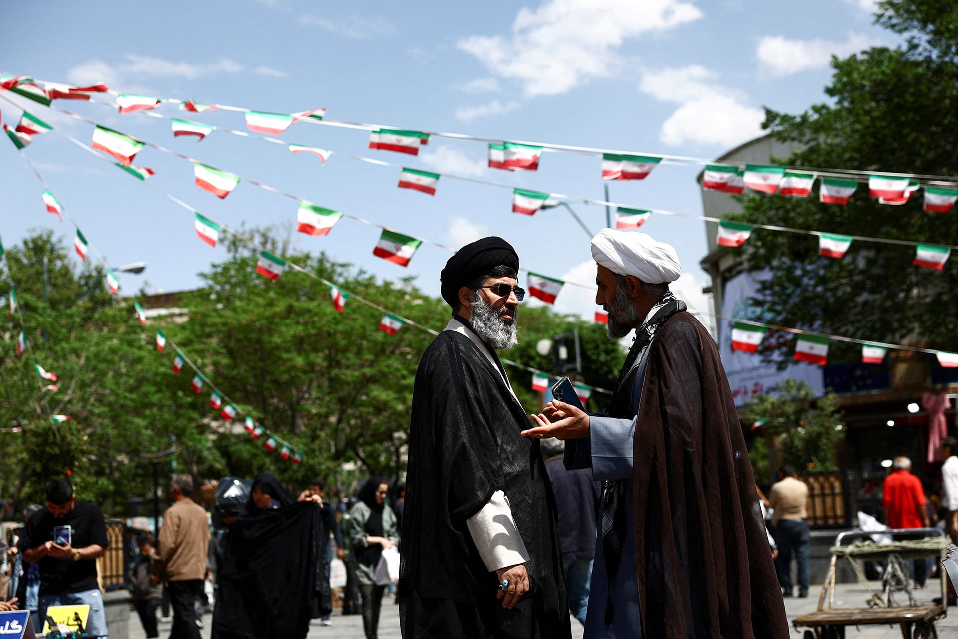 <p>Iranian clerics speak in Tehran Bazaar, amid a ceasefire between U.S. and Iran, in Tehran, Iran, April 21, 2026. </p>
