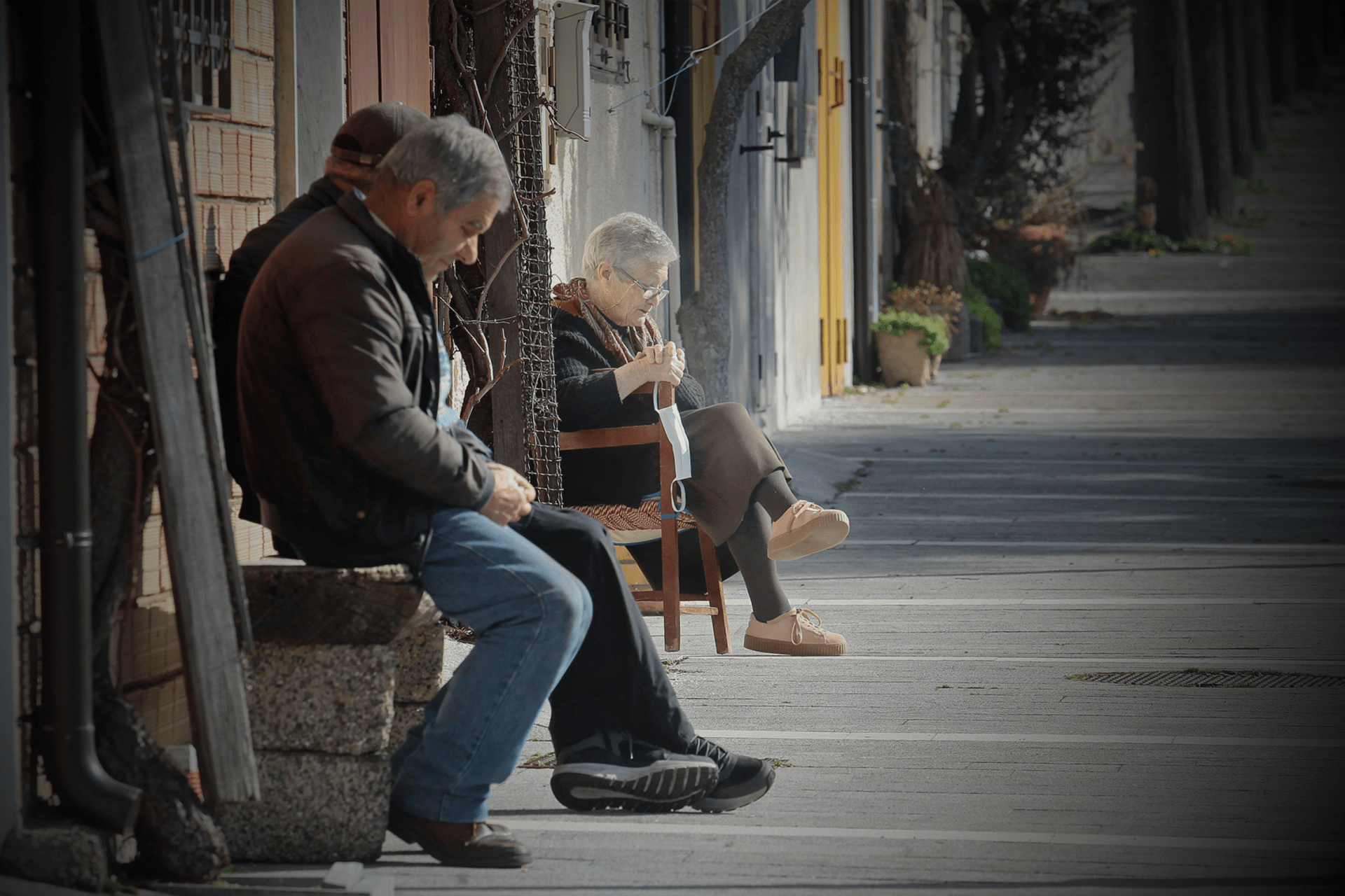 Maria Blumetti, one of the few female residents left, sits on a bench outside her home on February 19, 2021 in San Paolo Albanese (Potenza), southern Italy.