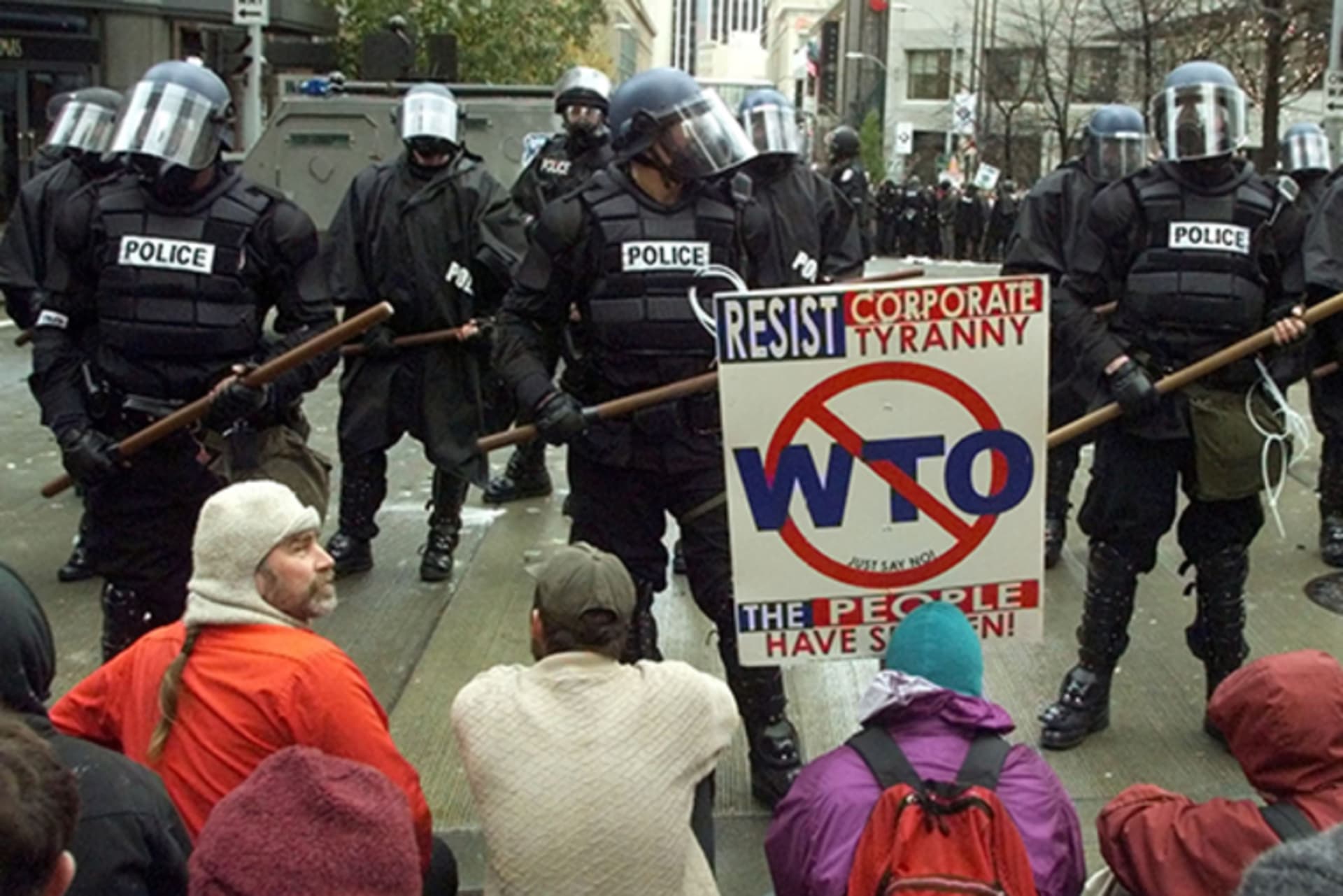 Protesters block a police line from moving forward in a downtown Seattle intersection on November 30, 1999, on the first day of meetings for the World Trade Organization conference.