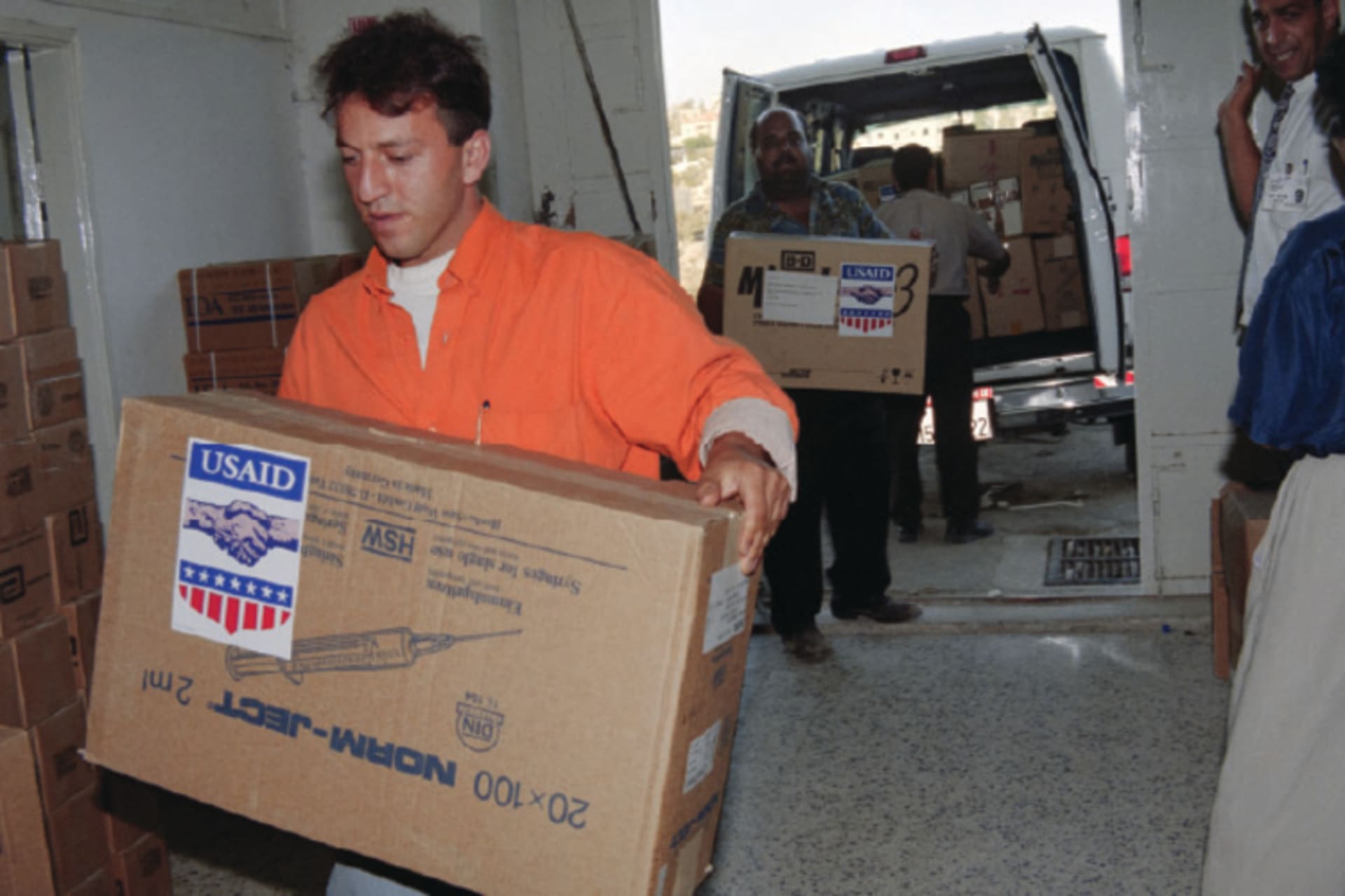 USAID Emergency workers unload medical supplies donated by the United States to the Palestinian Ministry of Health, in Ramallah, Palestine on January 1, 1996.