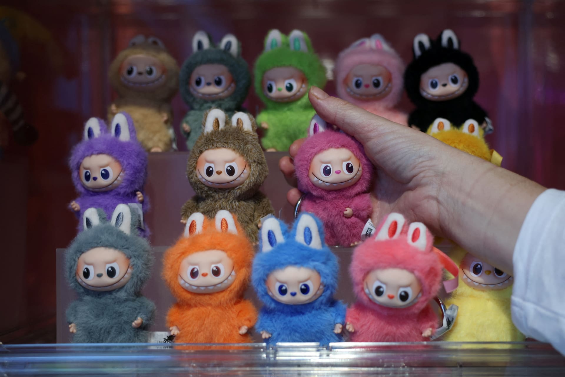 <p>A person holds a PopMart Labubu doll during a press preview at an AliExpress pop-up store in London, Britain, on November 11, 2025.</p>
