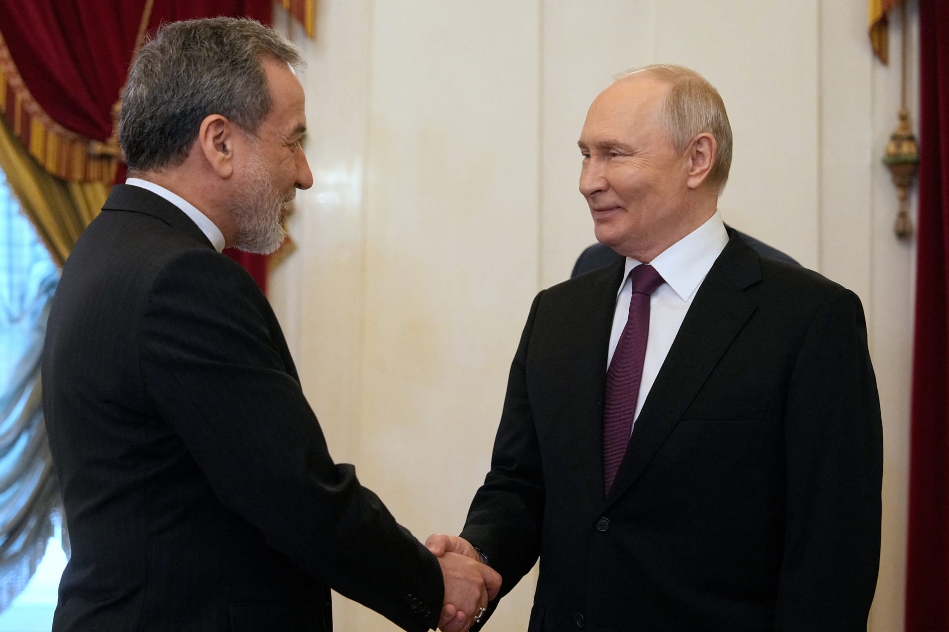 <p>Russian President Vladimir Putin shakes hands with Iranian Foreign Minister Abbas Araqchi during a meeting at the Boris Yeltsin Presidential Library in Saint Petersburg, Russia, on April 27, 2026.</p>

