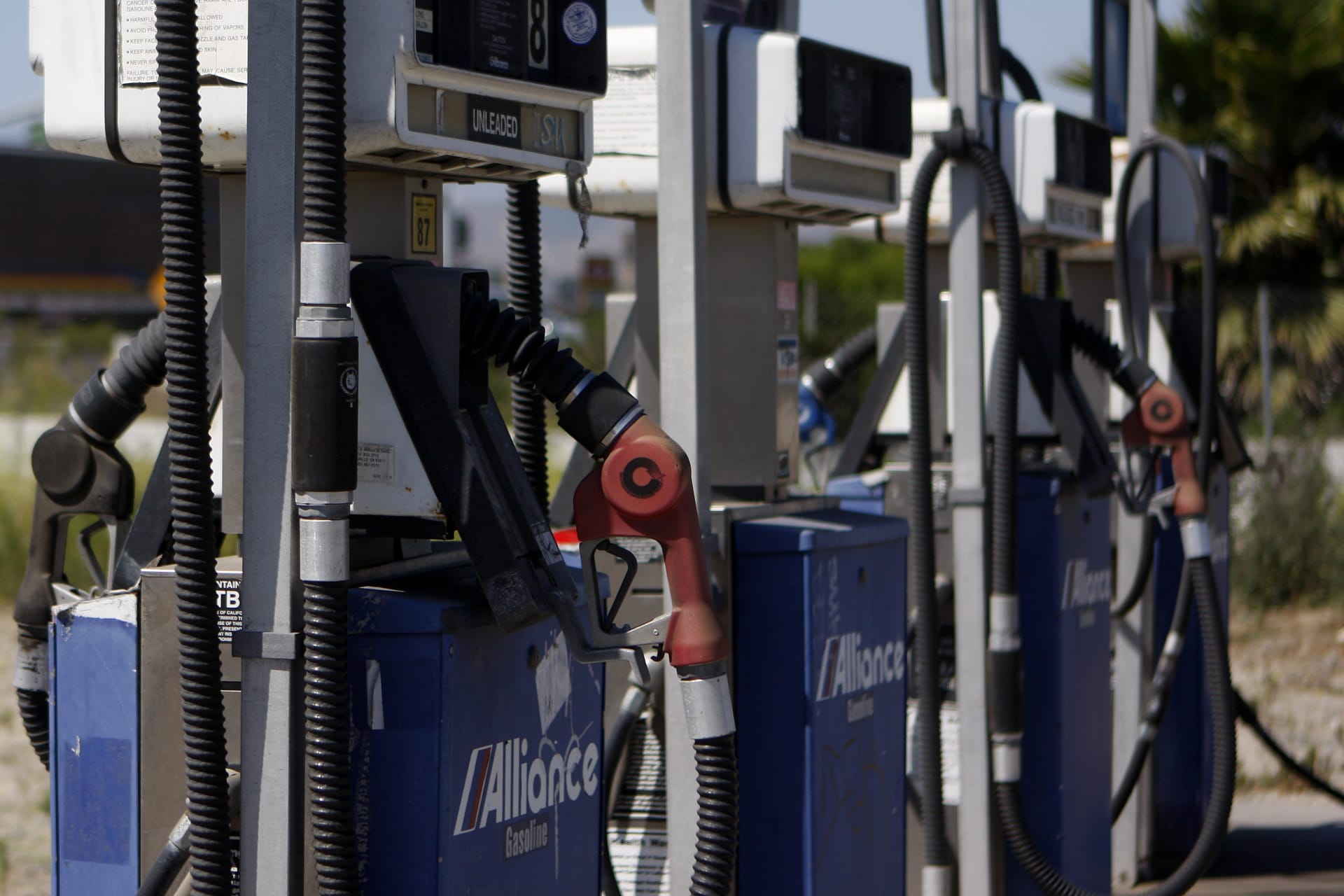 A close up image of gasoline pumps at a closed-down Alliance gas station in Ventura, California