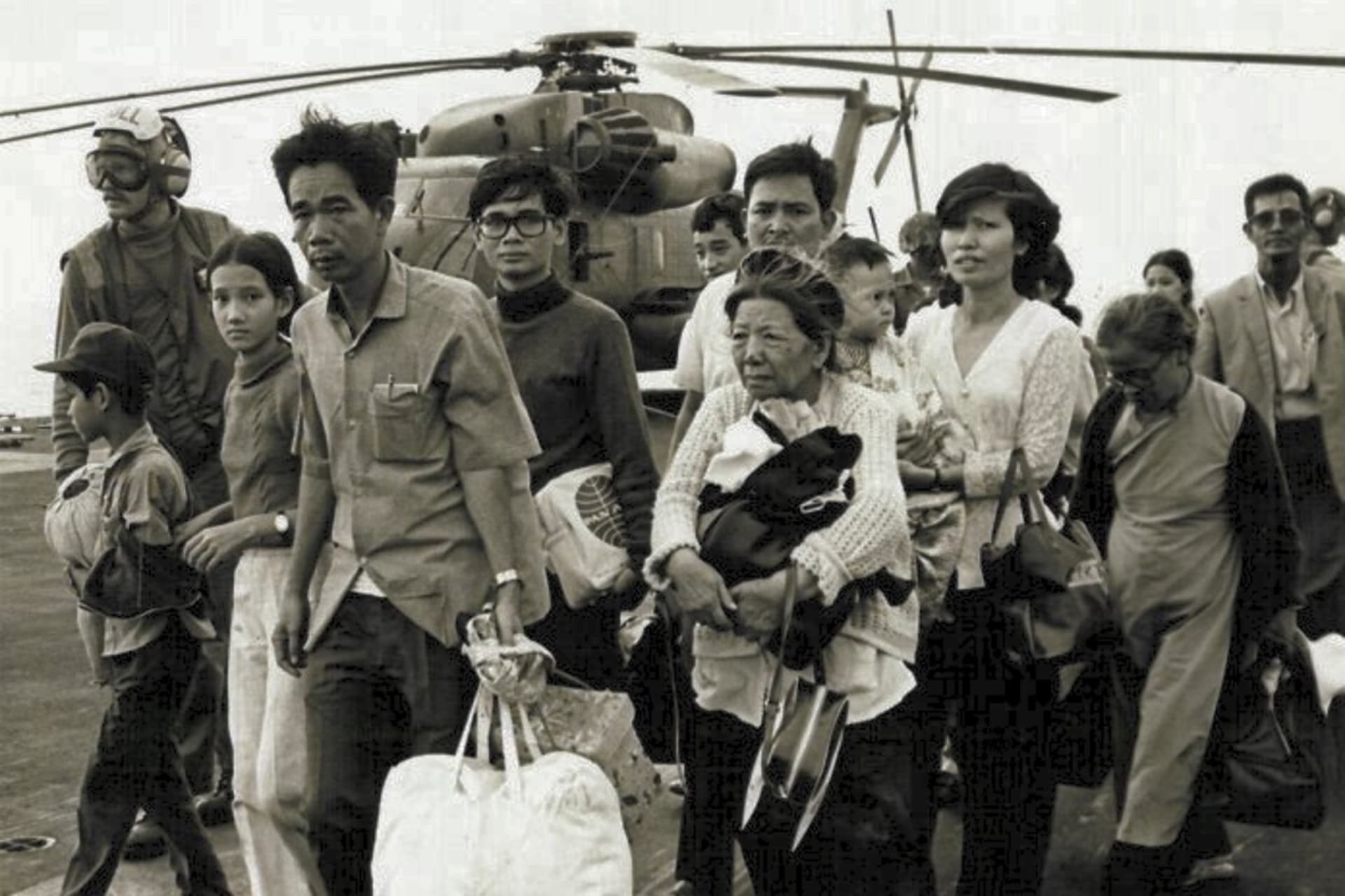 <p>South Vietnamese refugees evacuated by a U.S. Marine helicopter land onboard a U.S. Navy ship as part of Operation Frequent Wind, April 30, 1975</p>
