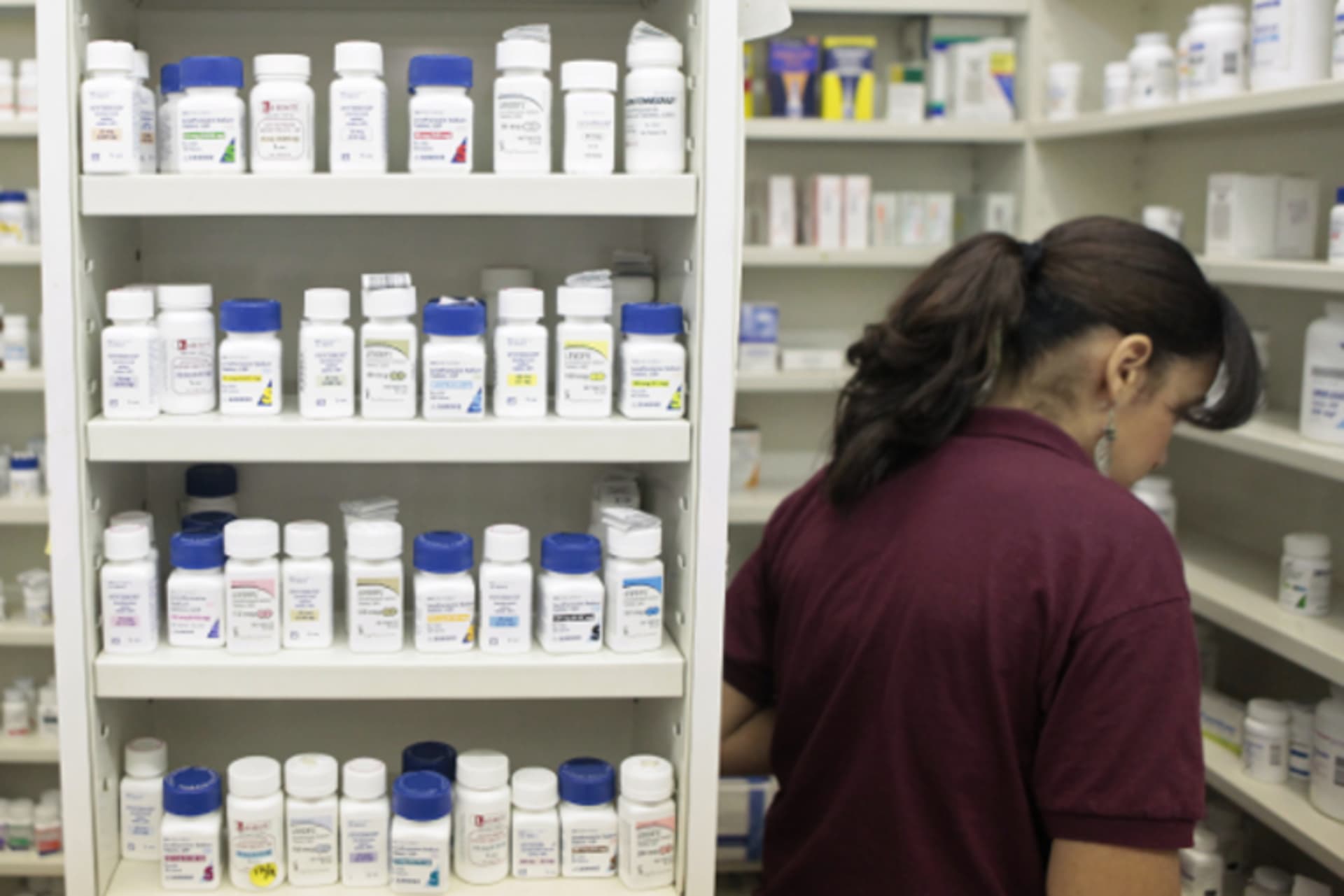 A pharmacy employee looks for medication in New York, on December 23, 2009.