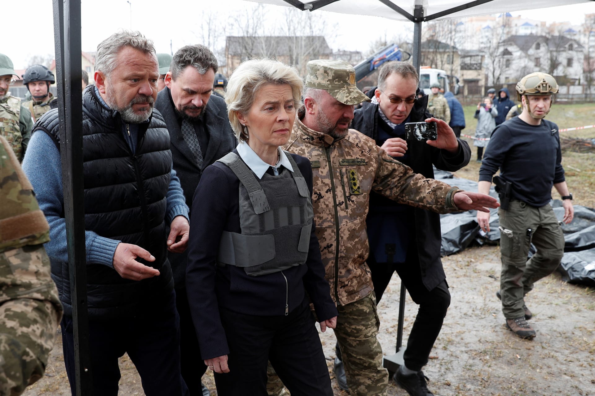 European Commission President Ursula von der Leyen wears a protective vest while visiting the Ukrainian town of Bucha.